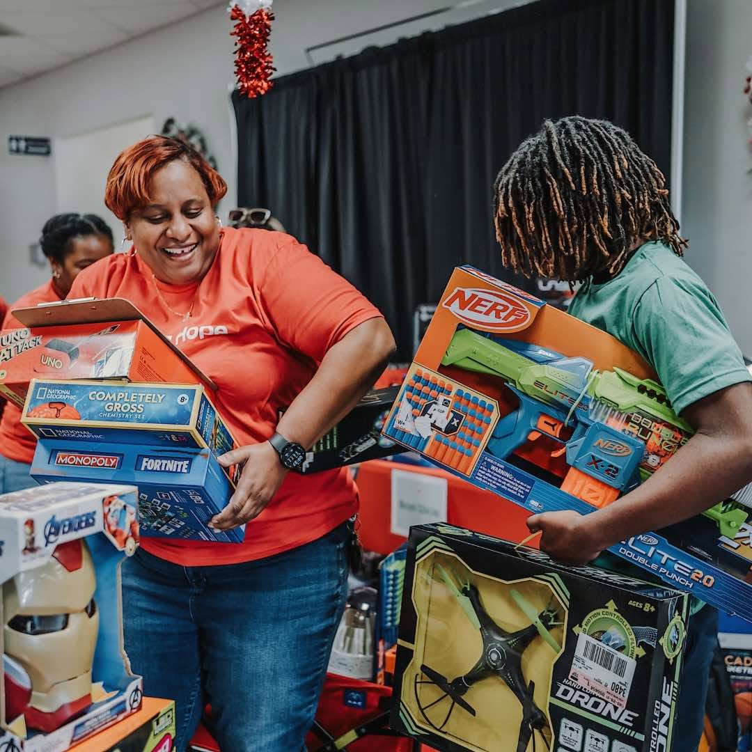 Giving Hope volunteers preparing toys for families