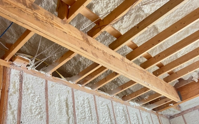Open cell spray foam insulation on walls and ceiling to reduce moisture in Texas homes