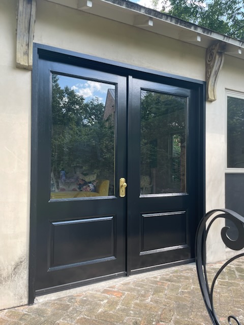 Exterior wall with smooth new paint finish after repainting