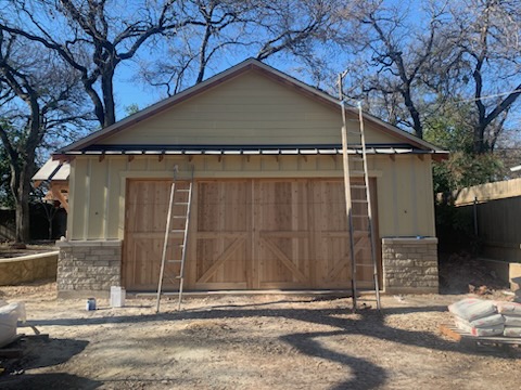 Exterior of home before painting with faded and weathered siding