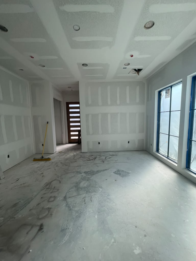 Interior room with scuffed and dated walls before painting