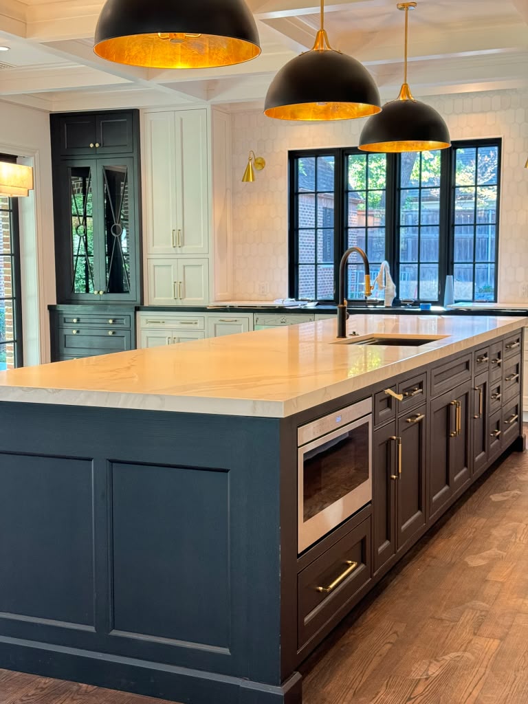 Kitchen with updated cabinet color and refreshed trim after painting