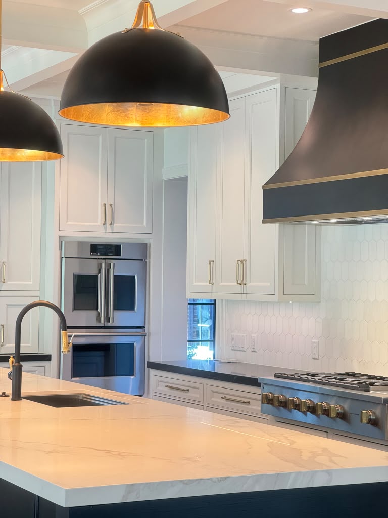 Kitchen with freshly painted cream-white cabinets and modern hardware in a DFW home