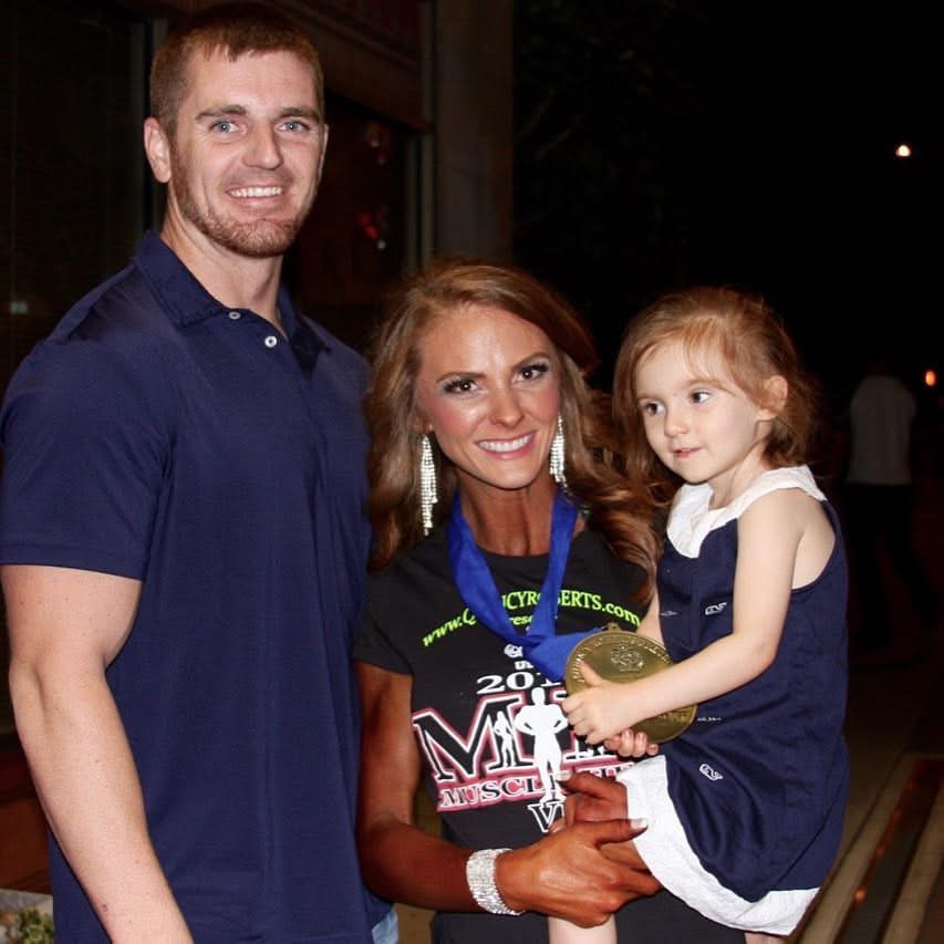 Krista with her family after her bodybuilding show