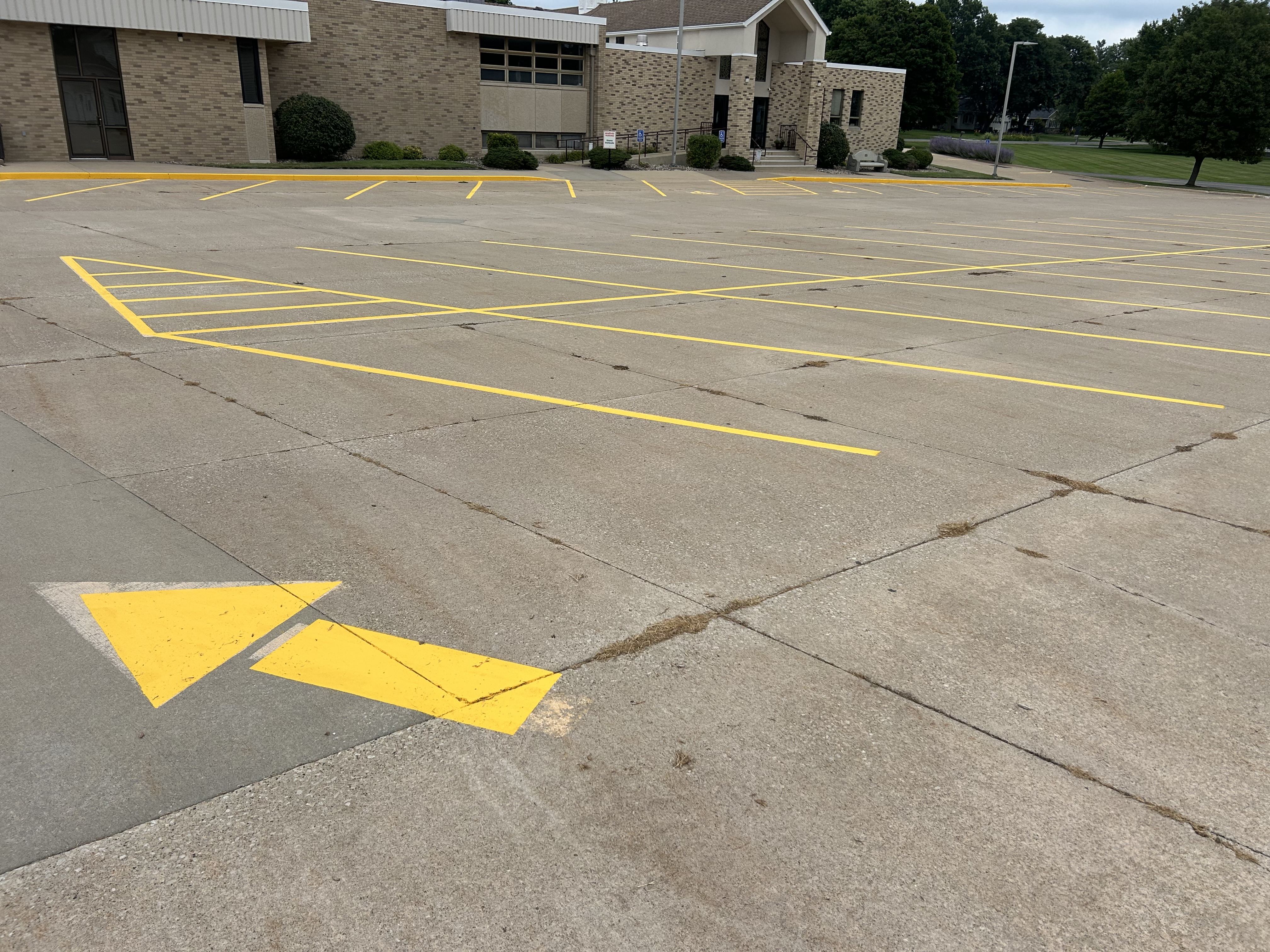 Completed parking lot line striping by Gus's Lining and Striping
