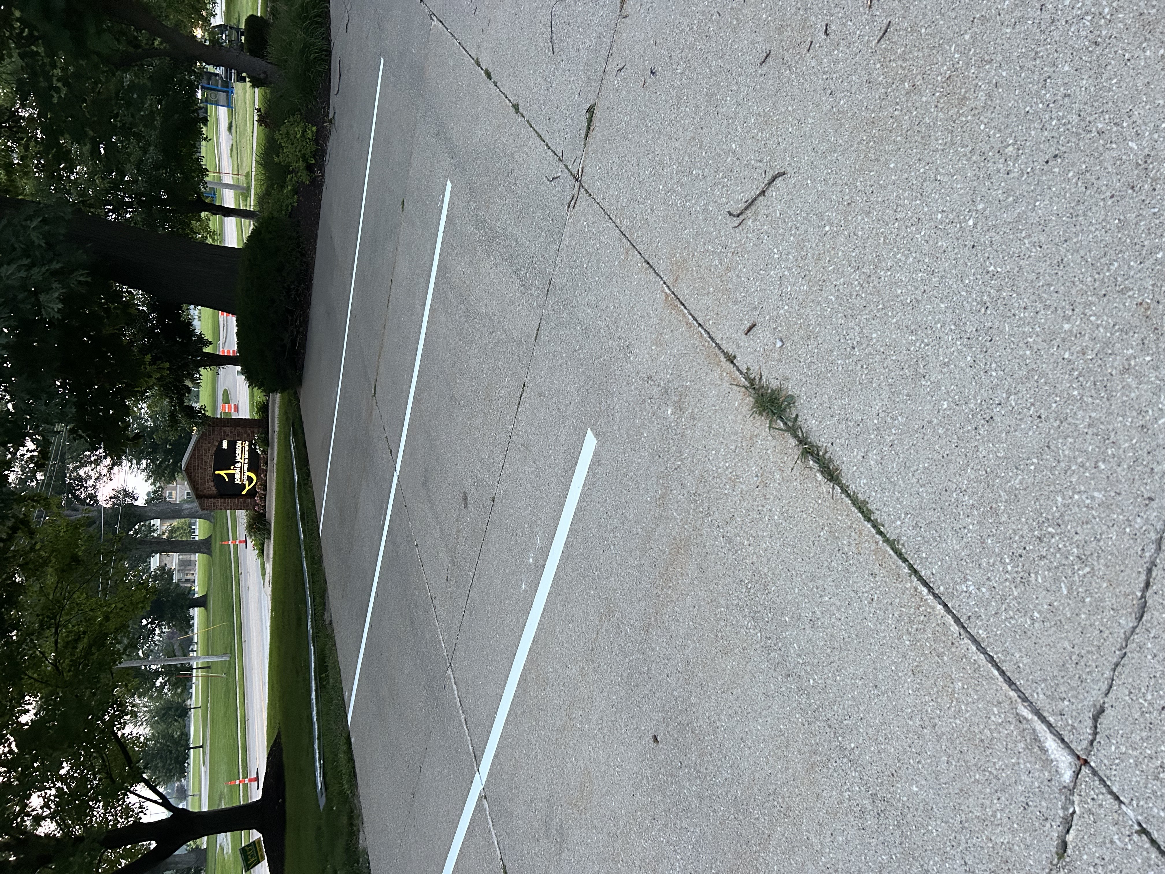 Fresh parking space line striping by Gus's Lining and Striping