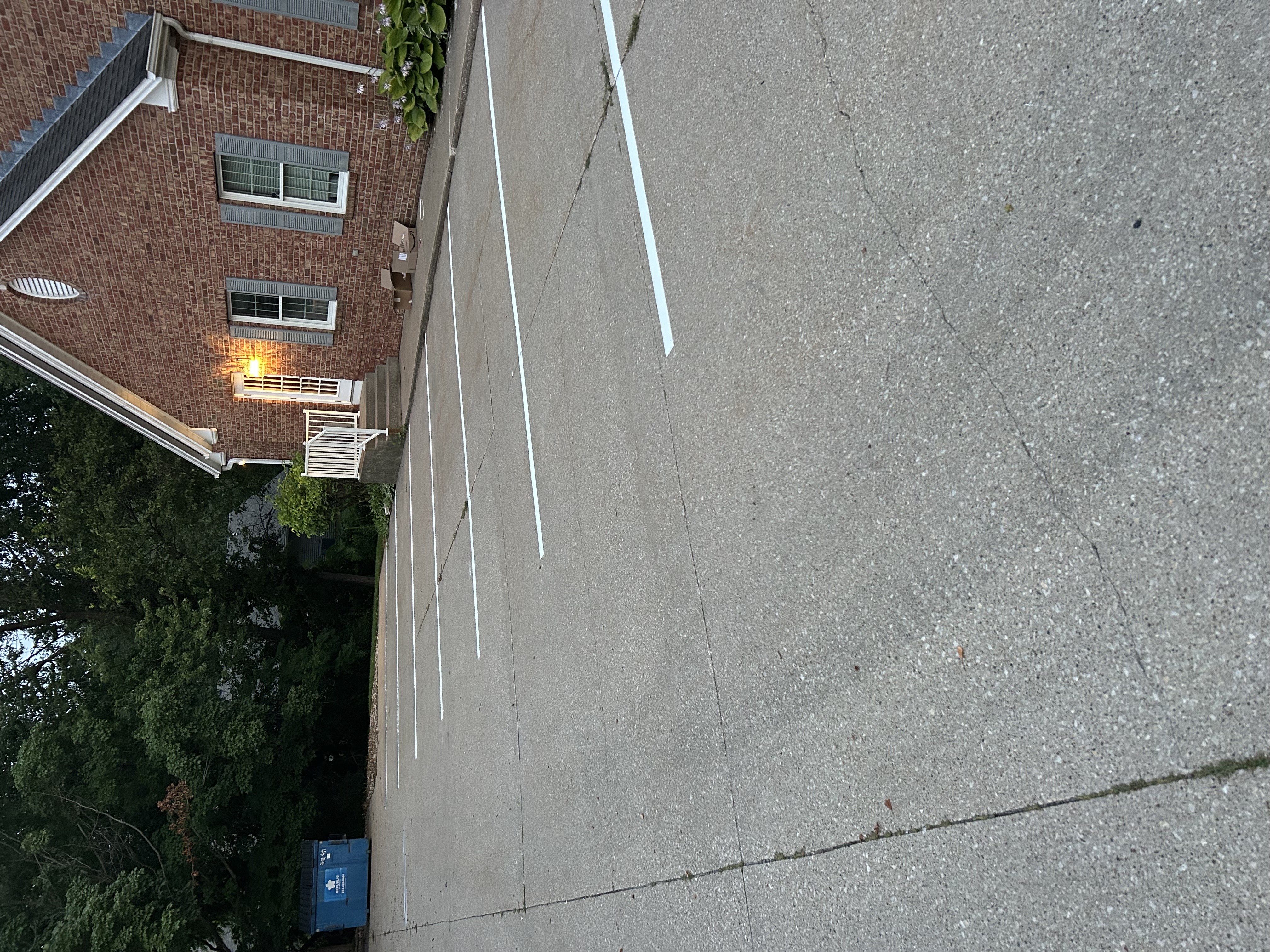 Completed parking lot striping with fresh stall lines by Gus's Lining and Striping