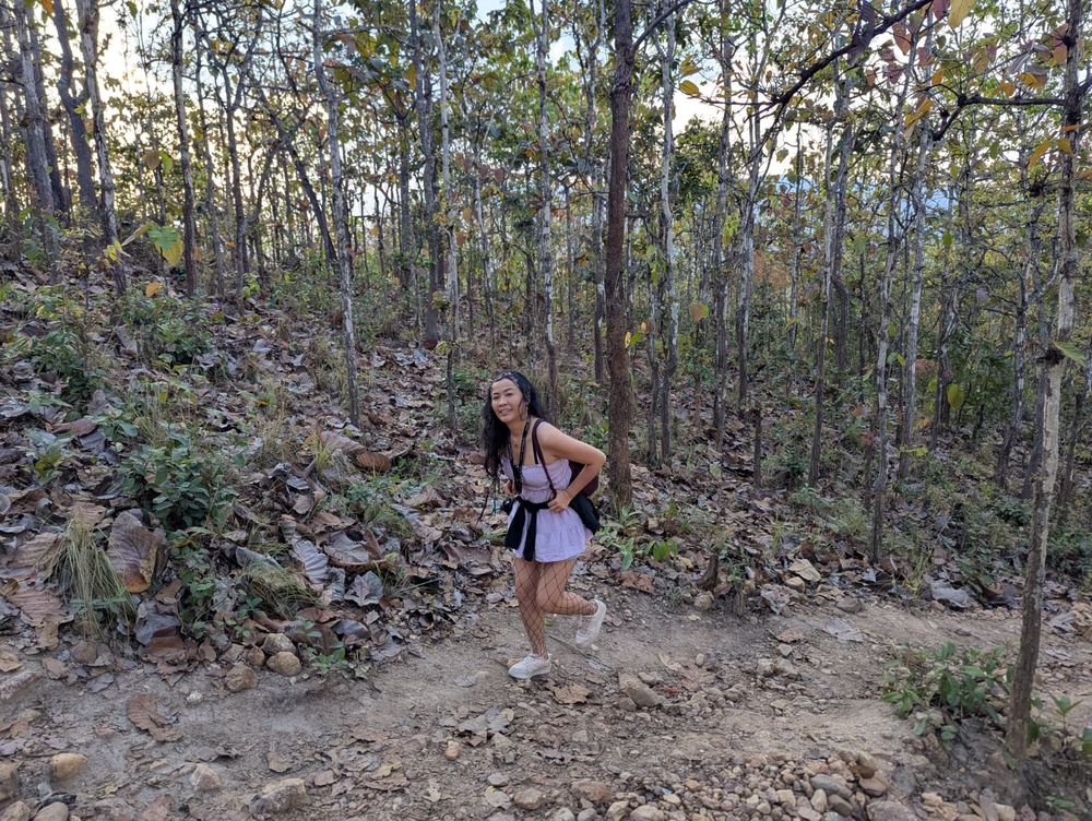Lilja smiling on a forest trail in Pai