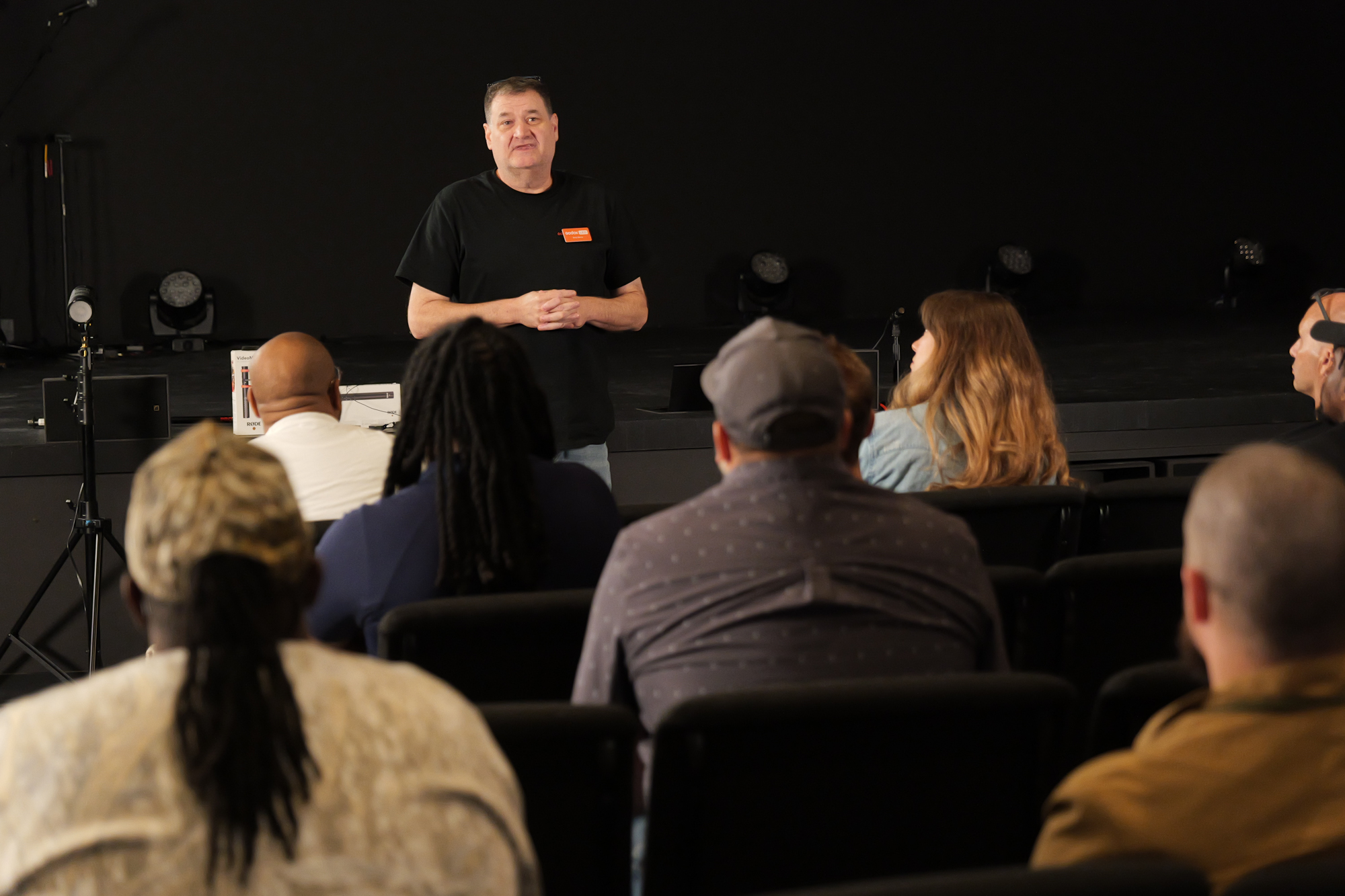 Attendees learning a camera workflow from an industry professional