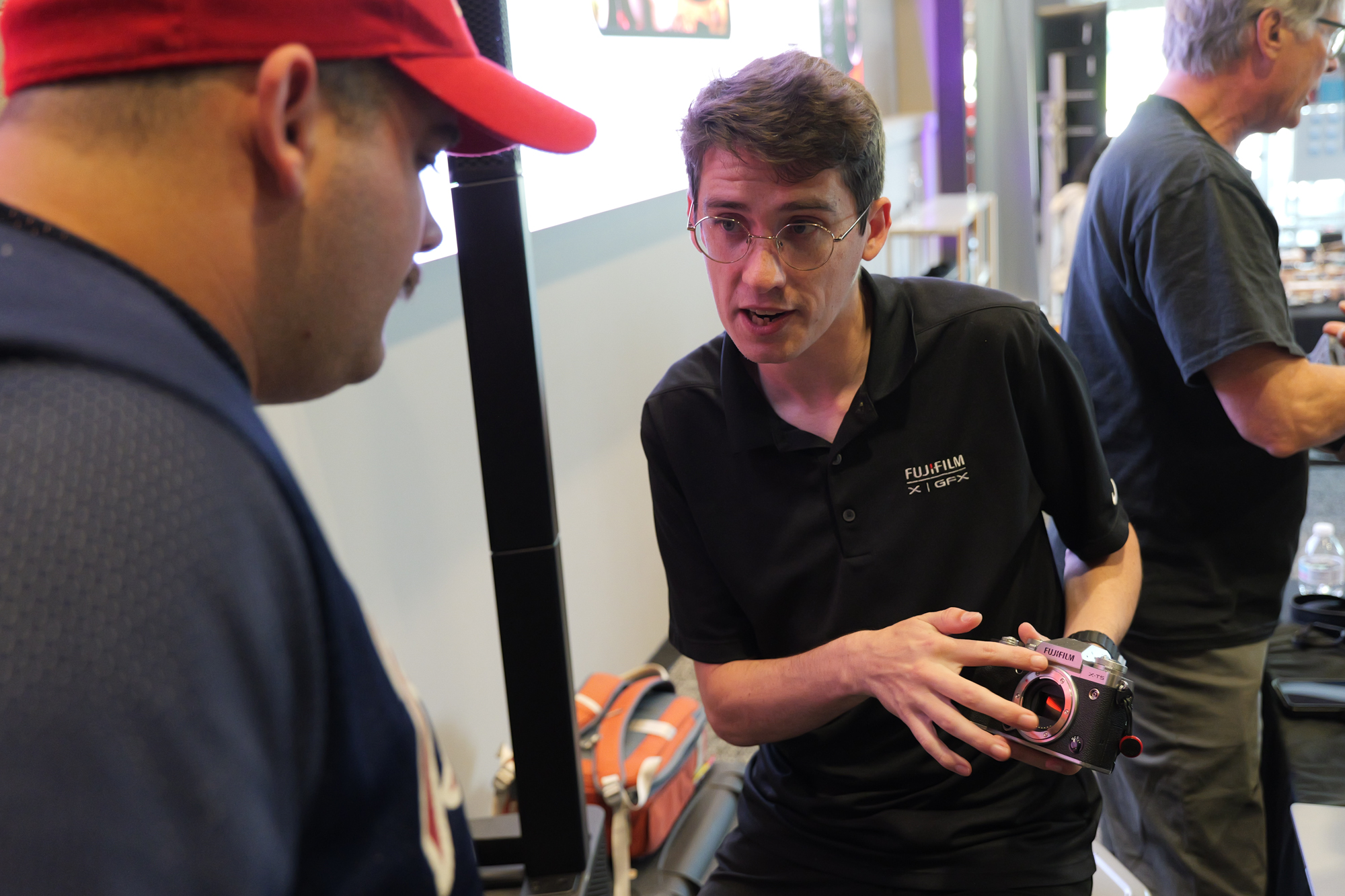A SmallRig representative explaining camera accessories