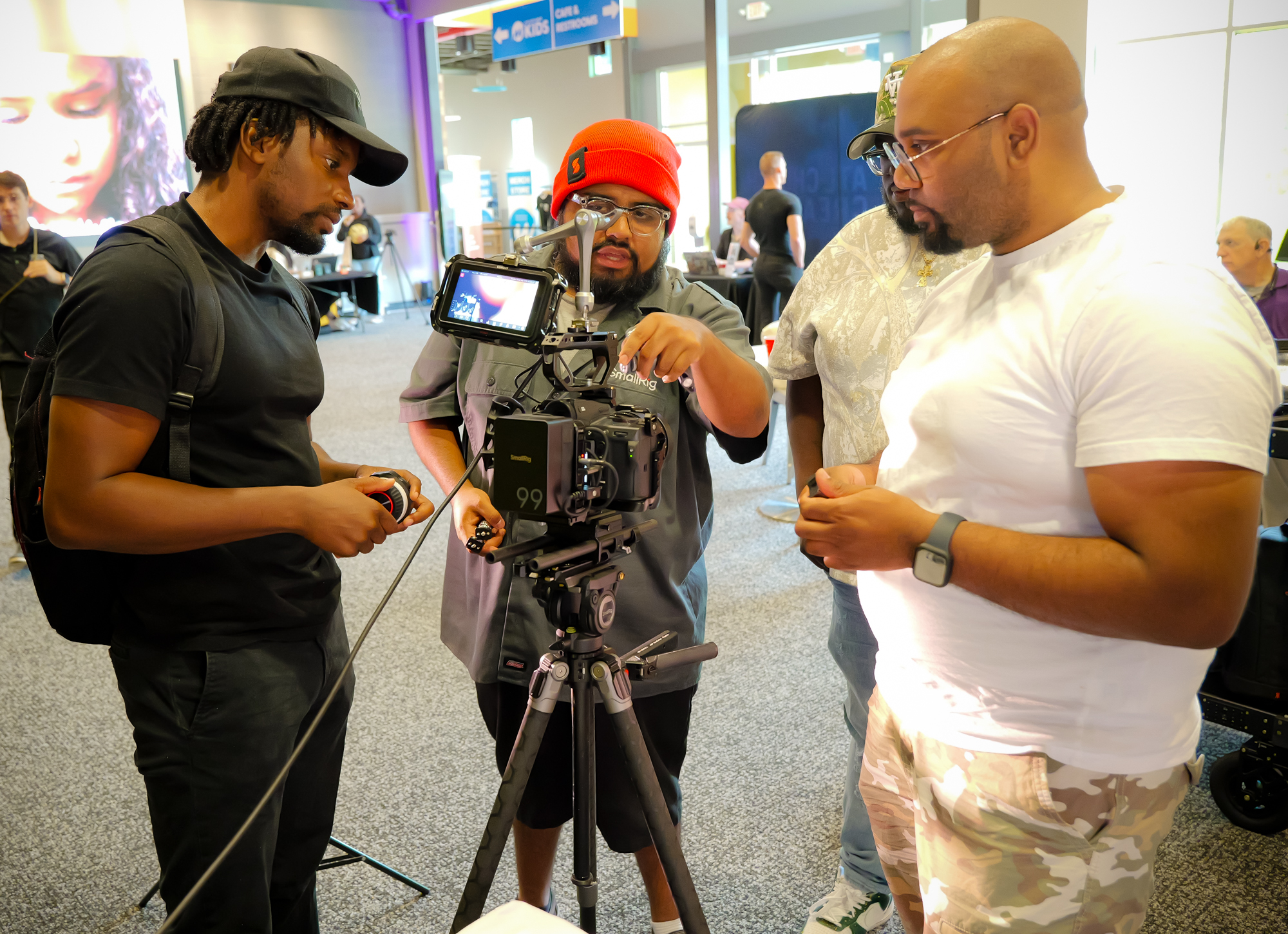 Church creatives reviewing a cinema camera together