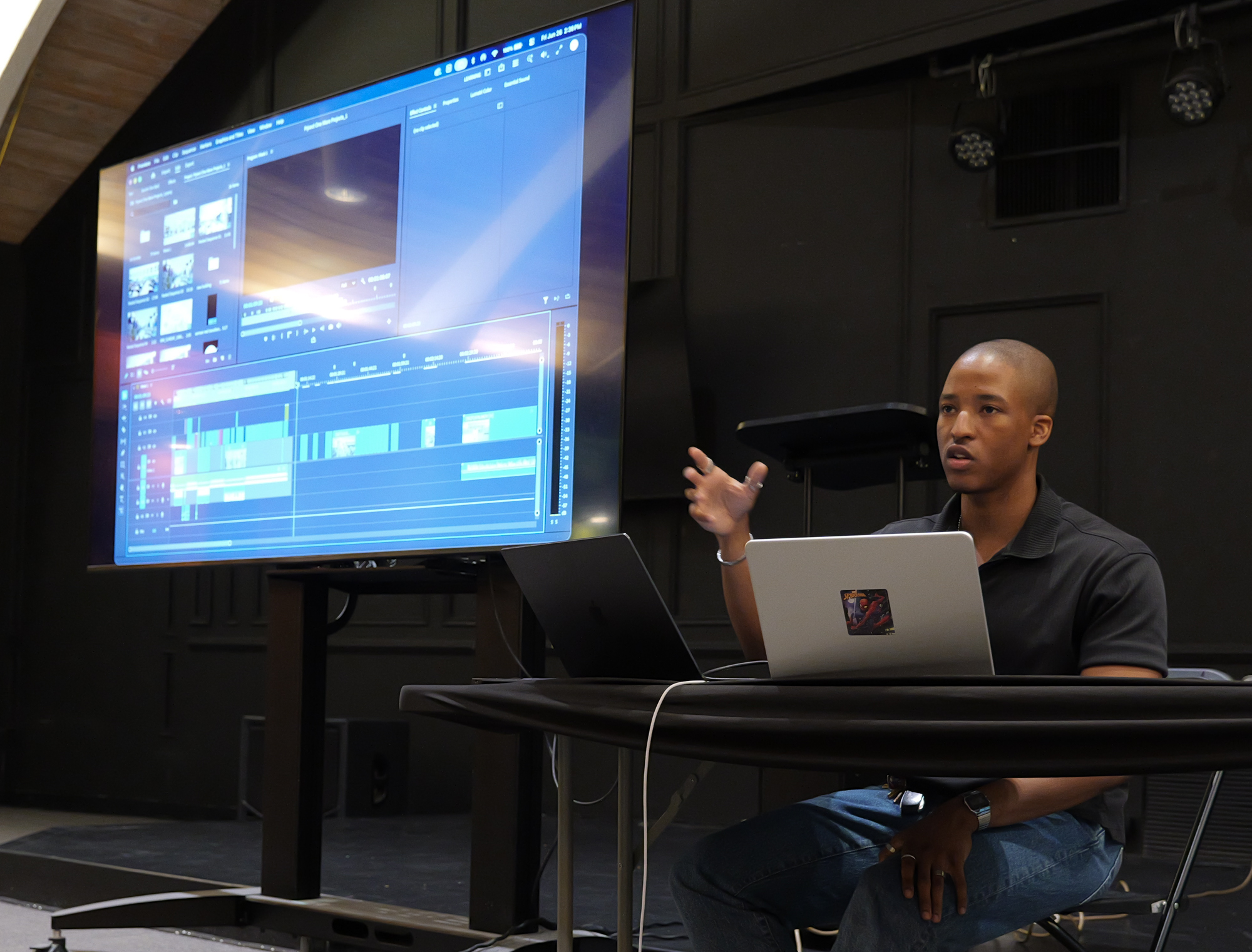 An instructor reviewing a camera monitor during a Fujifilm Xperience