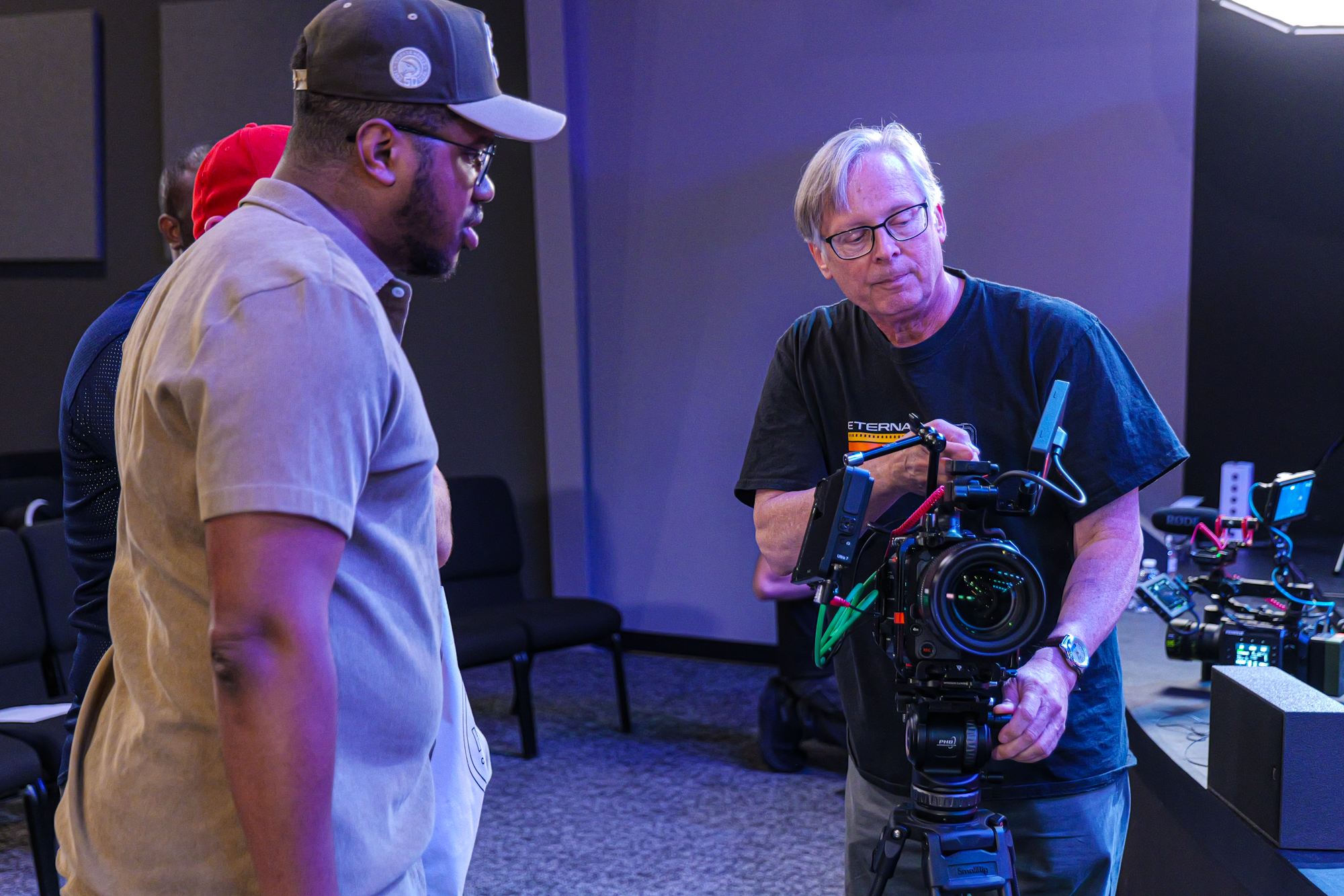 Attendees exploring a cinema rig together during a Fujifilm Xperience