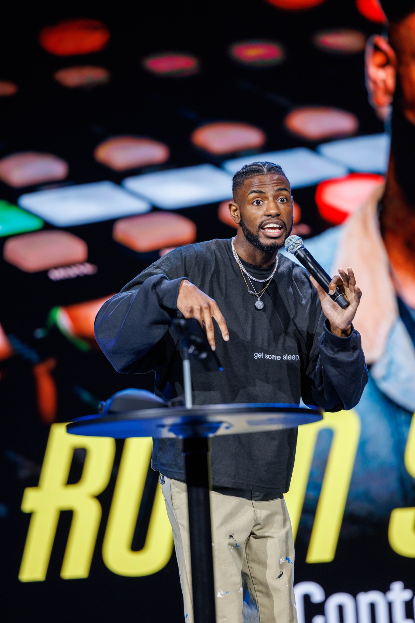 A church creative encouraging the community from the stage