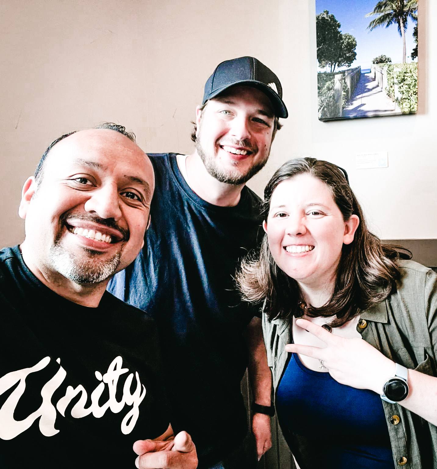Friends taking a photo together at a Monday Breakfast Meetup