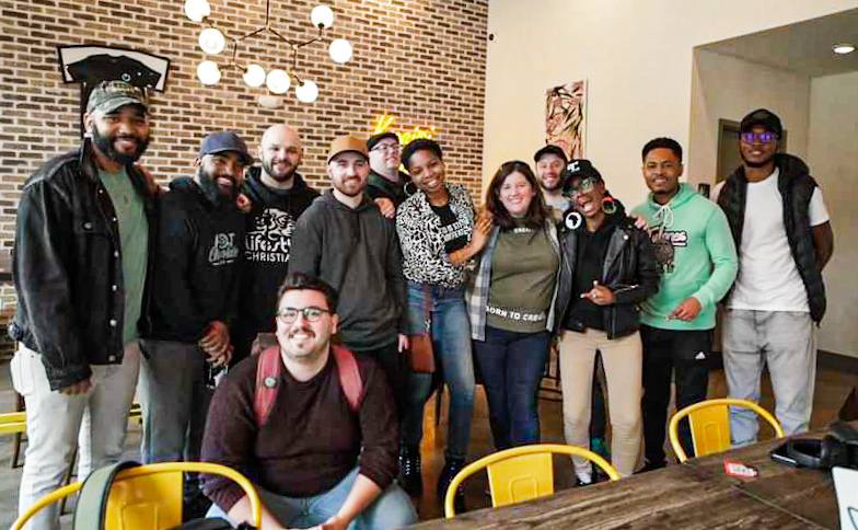 A Monday Breakfast Meetup group gathered around the table