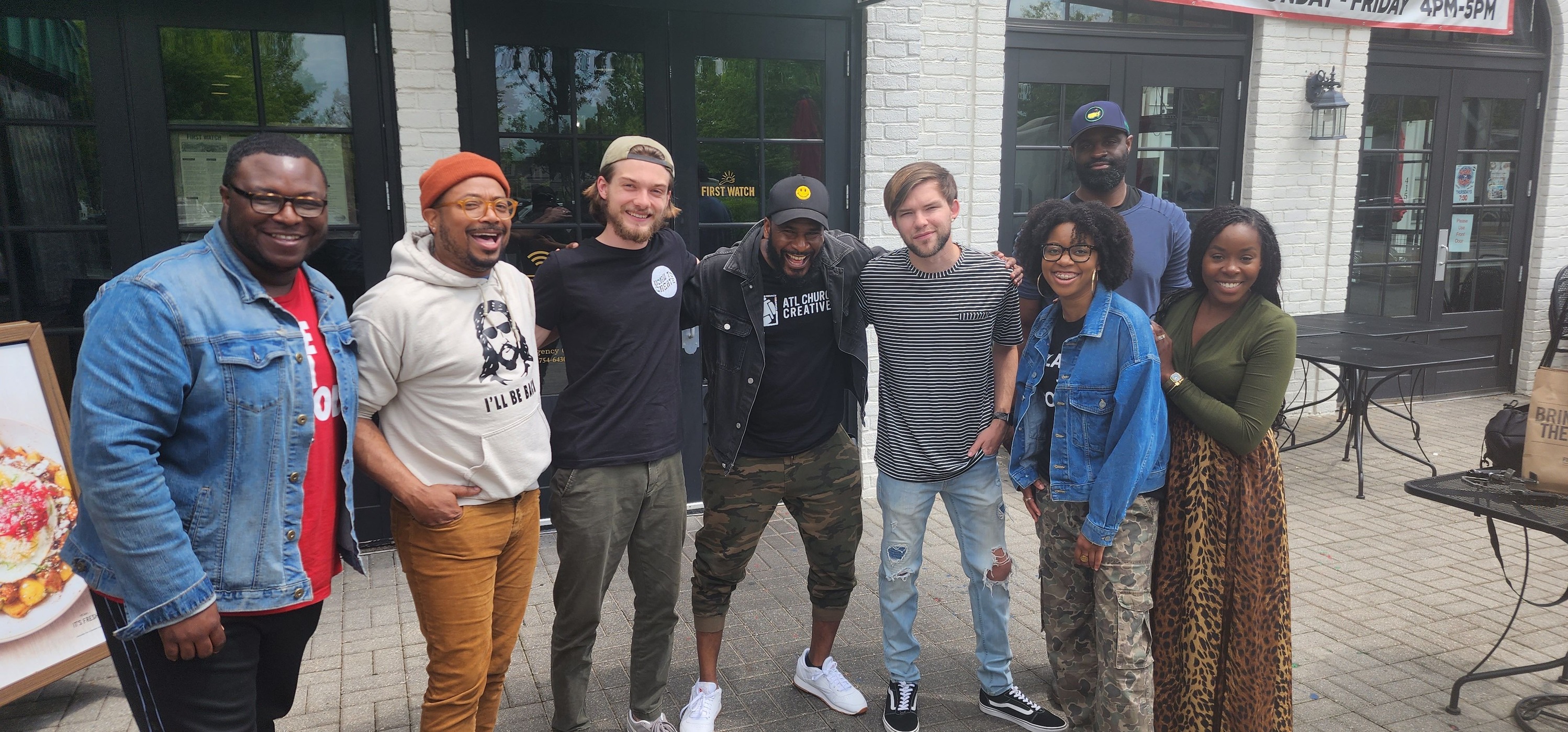 Church creatives connecting around a long breakfast table