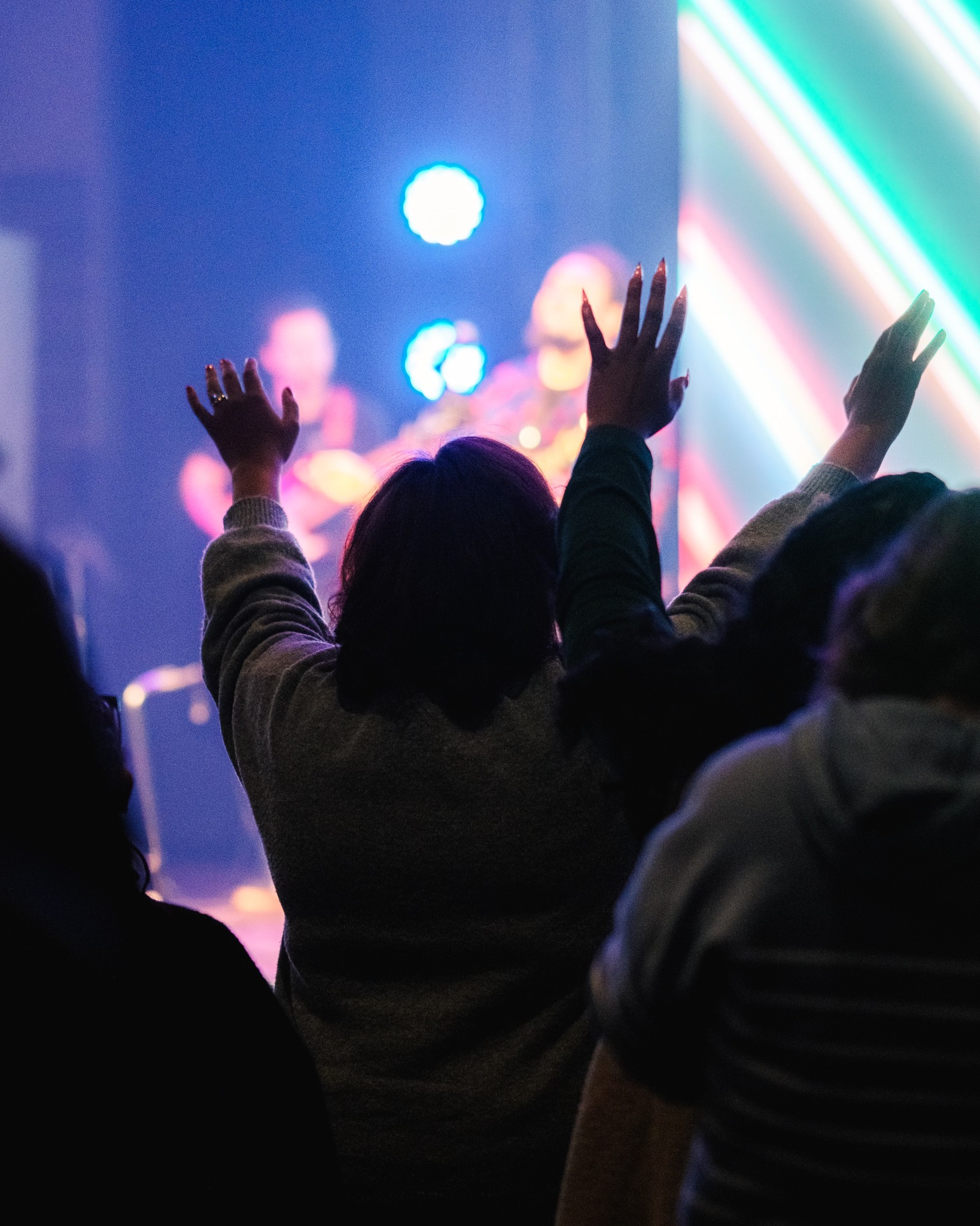 Conference attendees worshiping together