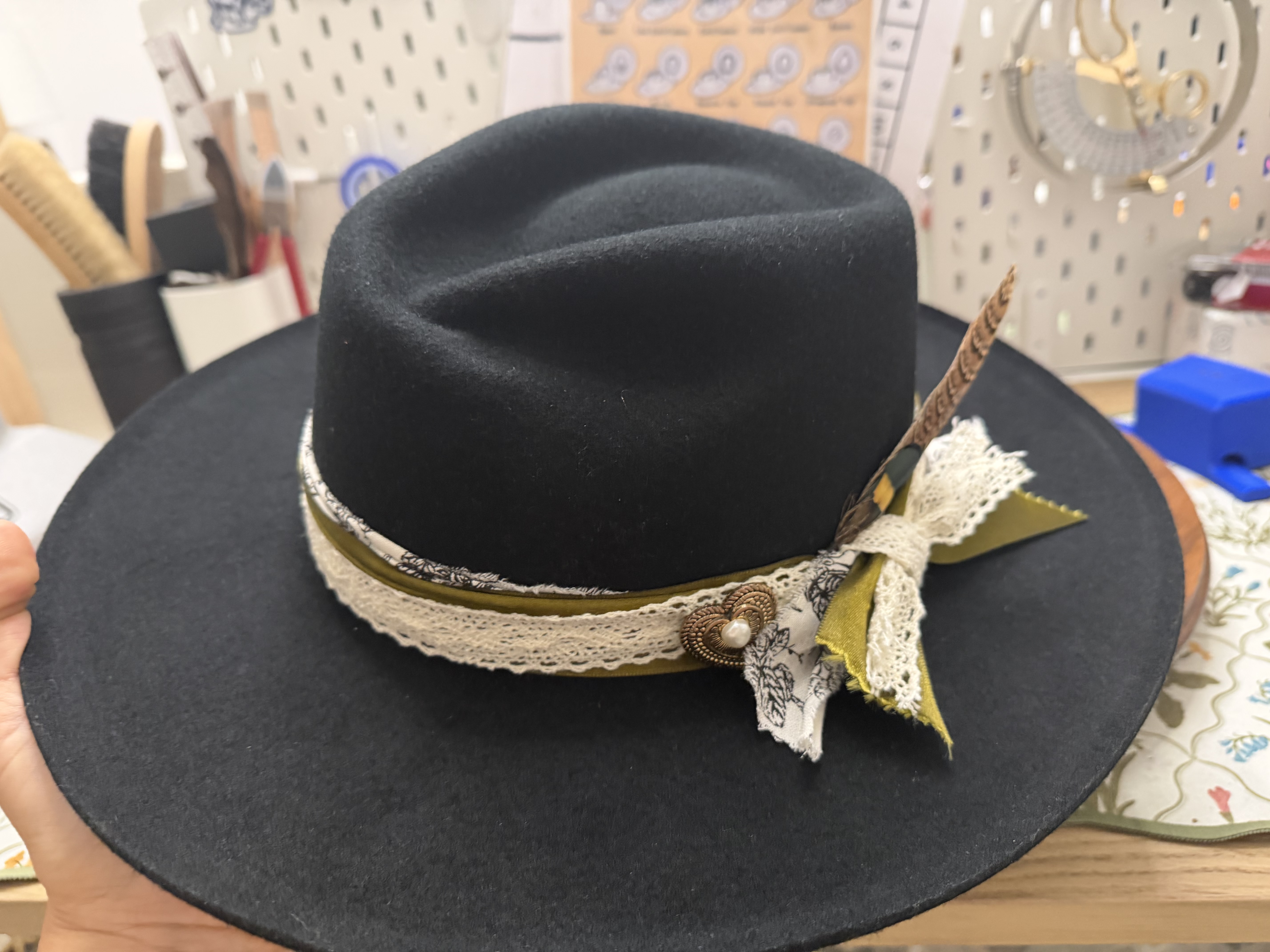 Custom black western hat with layered band and feather