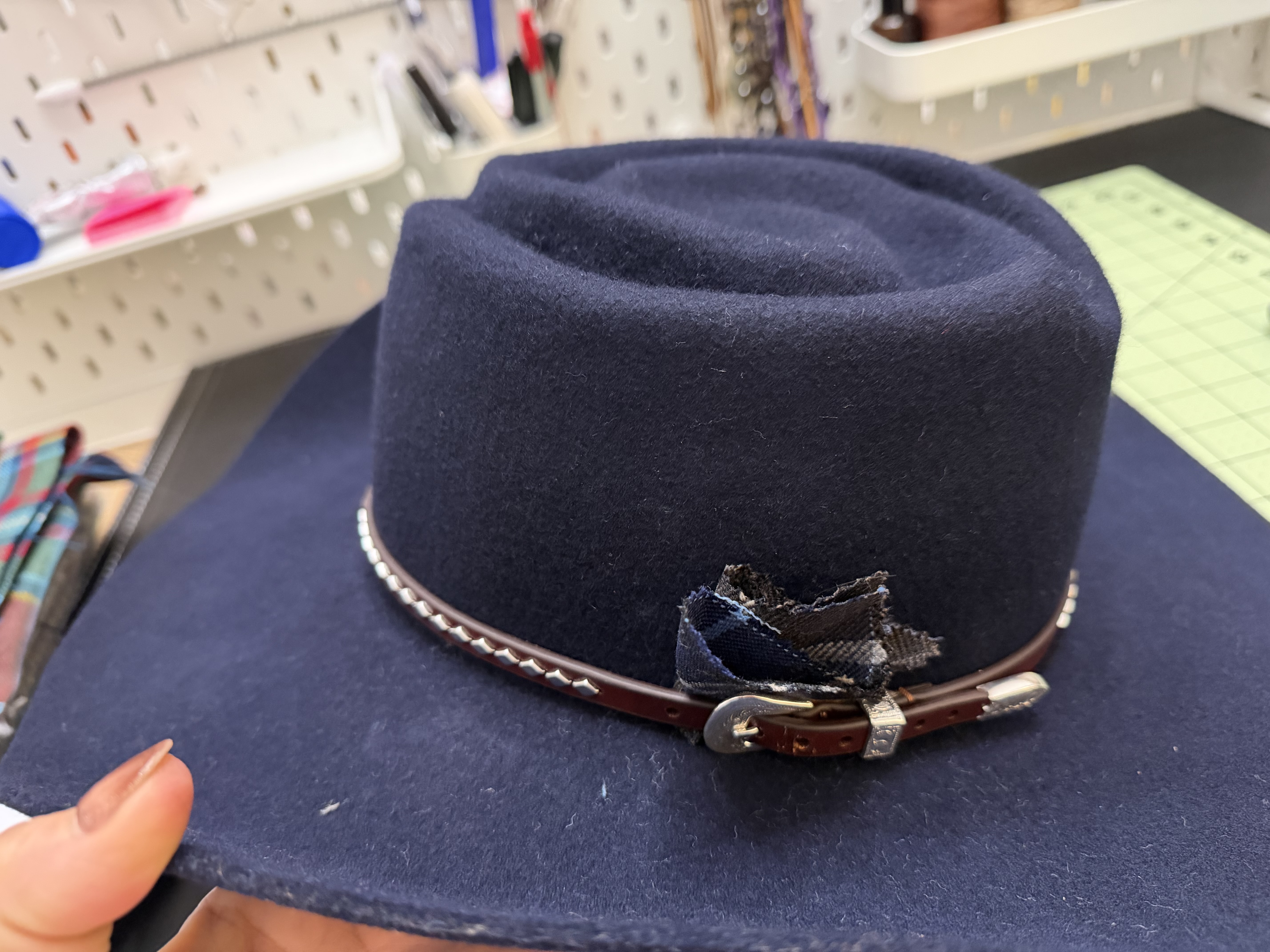 Custom navy western hat with hand-selected hat band