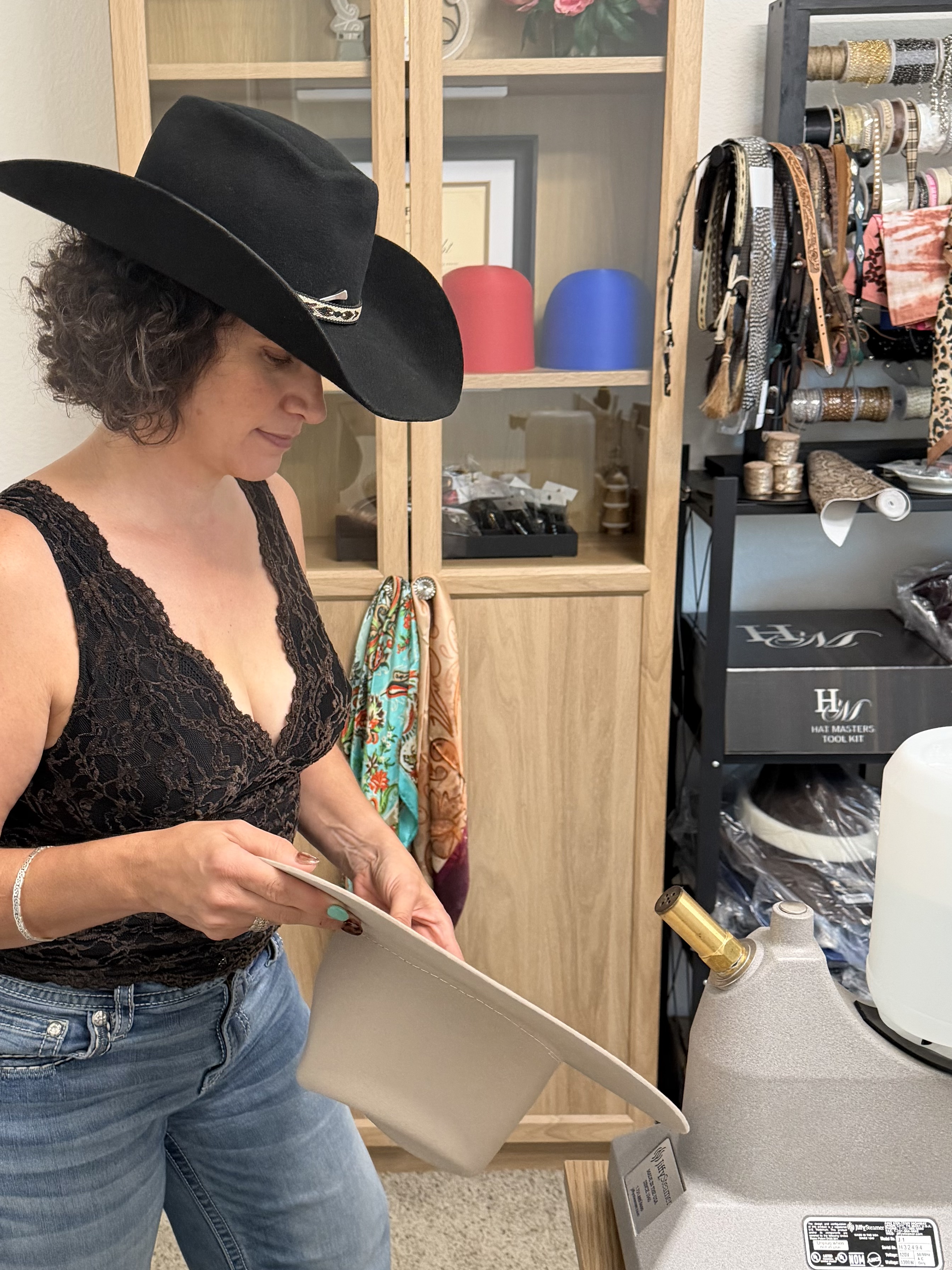 Tina shaping a western hat in the Highland Brims studio