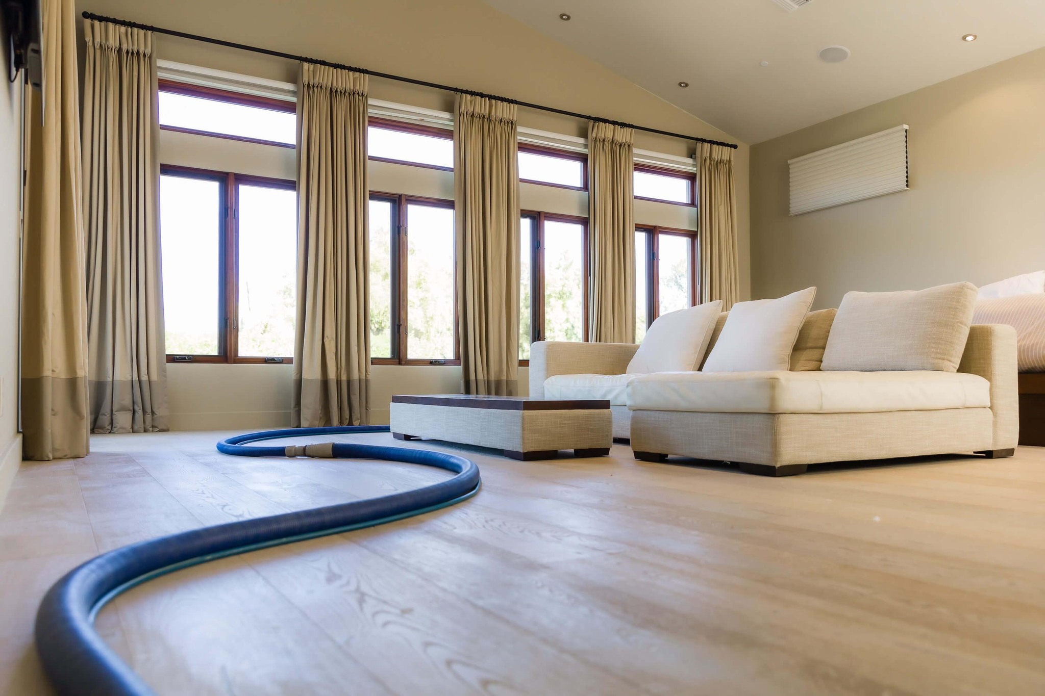 Professional hardwood floor cleaning service in progress using specialized equipment, provided by SteamWorx in the Phoenix Metro Area.