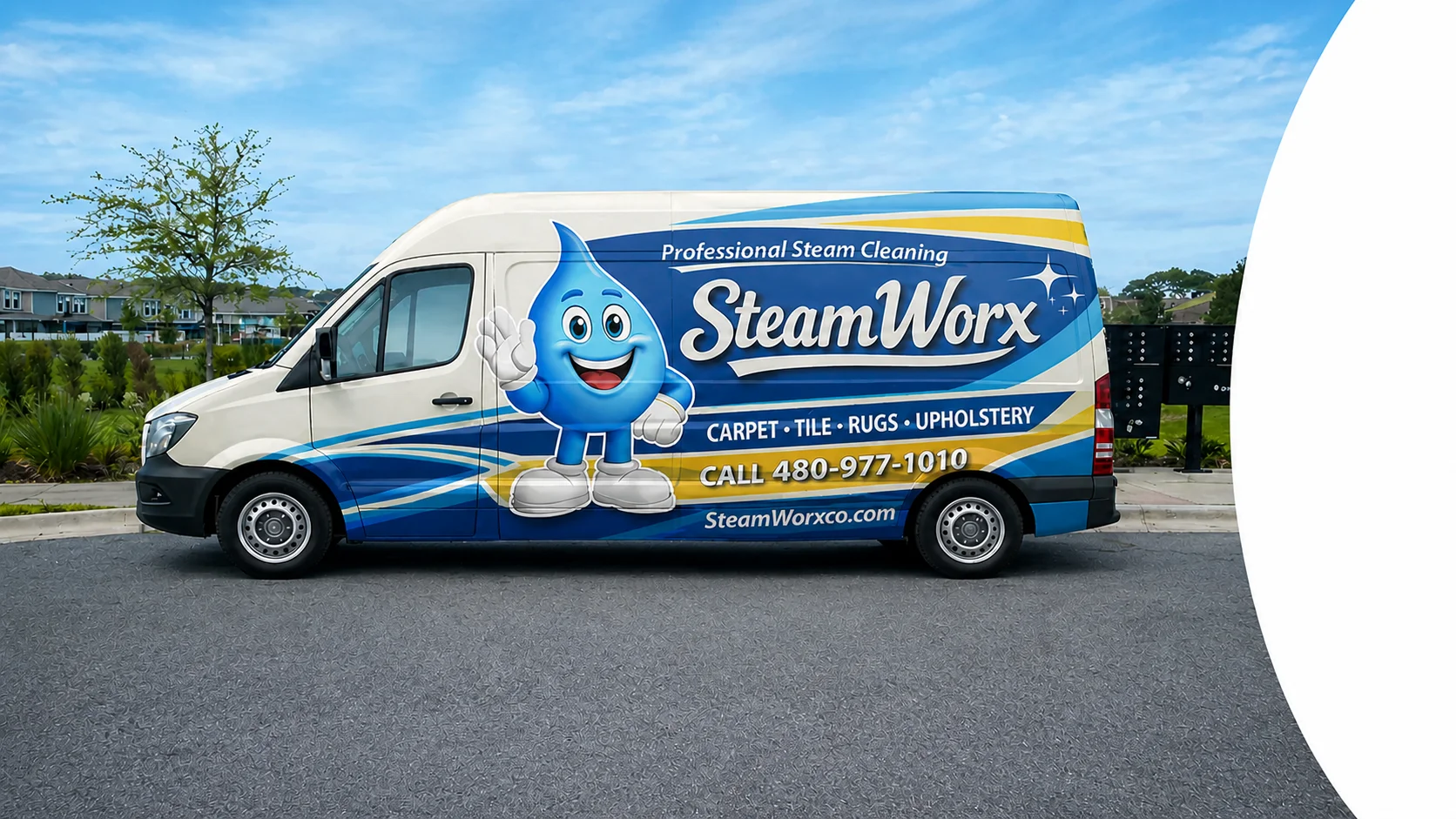 A white SteamWorx van with blue and yellow accents, and a cartoon water-drop mascot on the side, parked on an asphalt road.