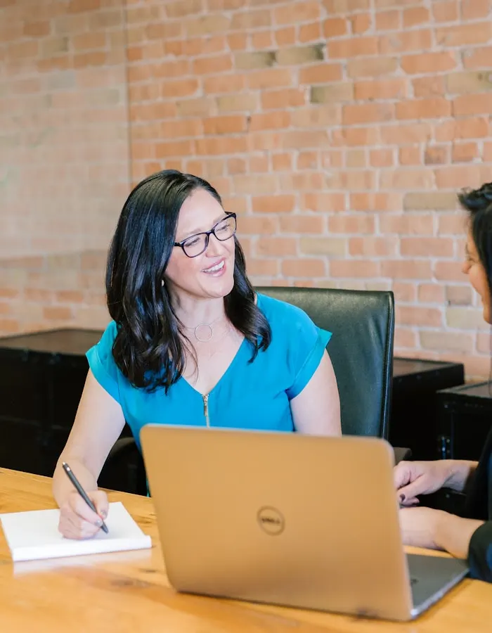 Small business owner working at laptop — relatable moment for entrepreneurs who feel overwhelmed