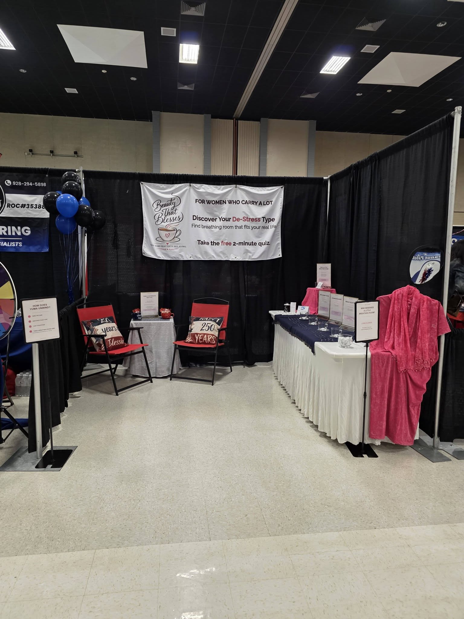 The Beauty That Blesses community expo booth featuring the De-Stress Type Quiz, CoffeeDates, breathing-room resources, and a welcoming conversation area. The Beauty That Blesses community expo booth featuring the De-Stress Type Quiz, CoffeeDates, breathing-room resources, and a welcoming conversation area.
