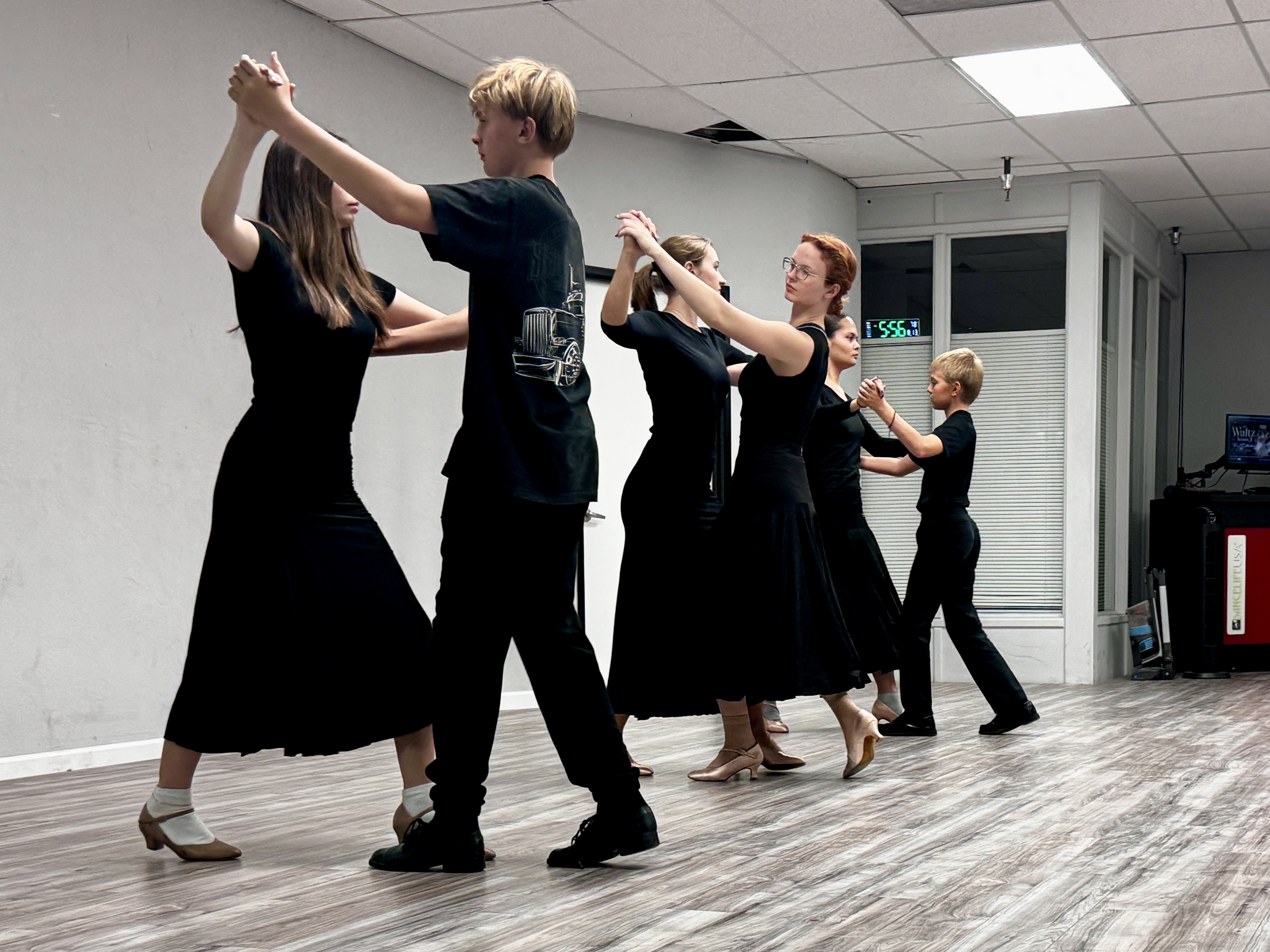 Youth Ballroom students participating in a dance class at The Phoenix Ballroom Academy in Chandler, Arizona.
