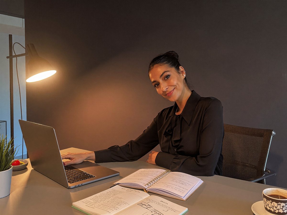 A real estate assistant at her desk