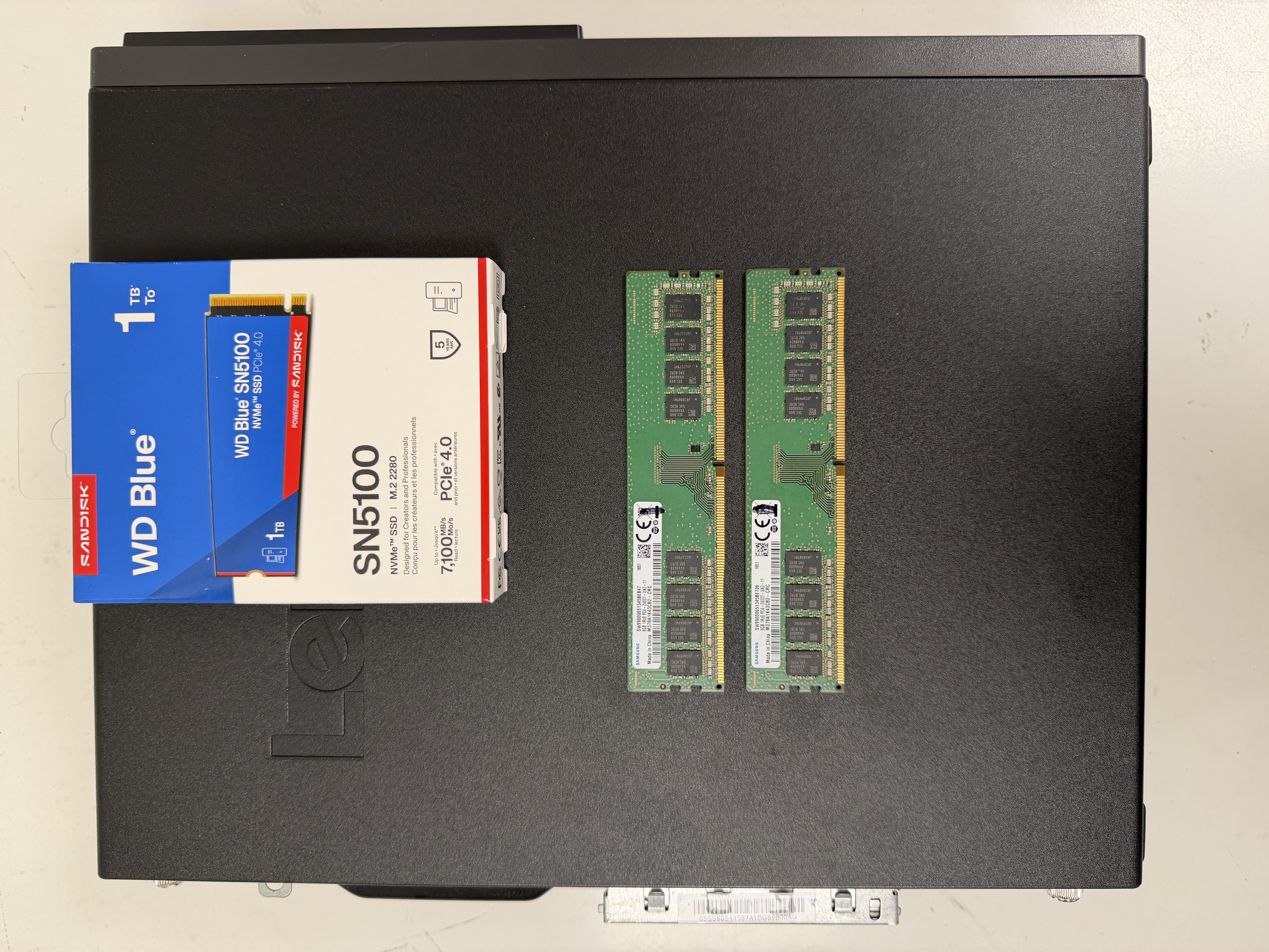 Technician at Priority 1 Computer Service Victoria BC installing 1TB SSD and 16GB RAM into refurbished Lenovo during computer upgrade and data transfer