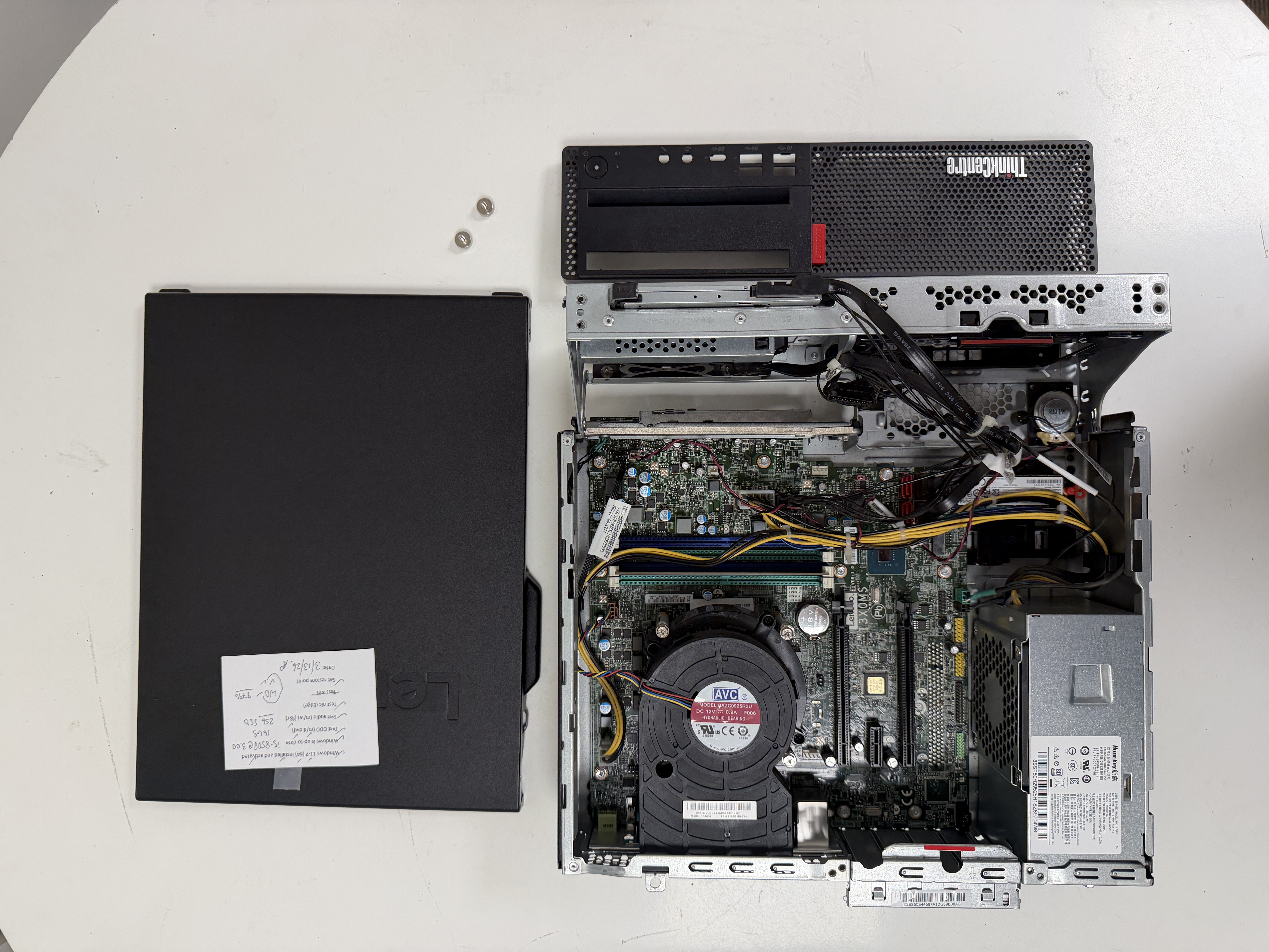 Technician at Priority 1 Computer Service Victoria BC installing 1TB SSD and 16GB RAM into refurbished Lenovo during computer upgrade and data transfer