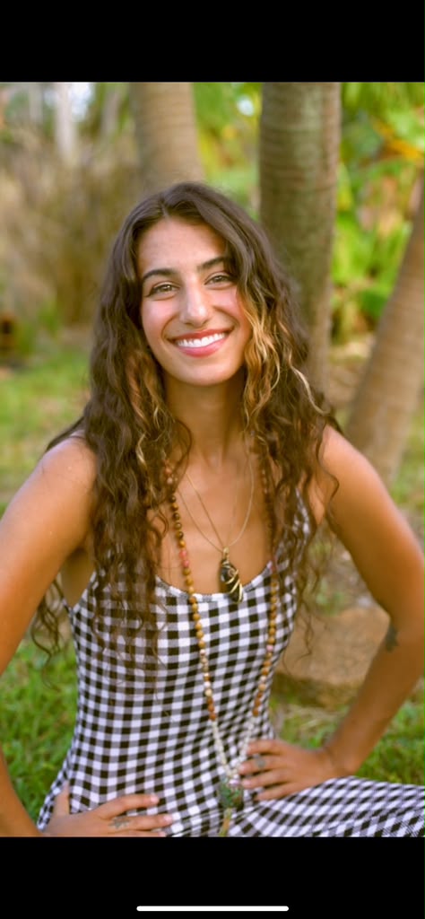 Savannah smiling beneath palm trees