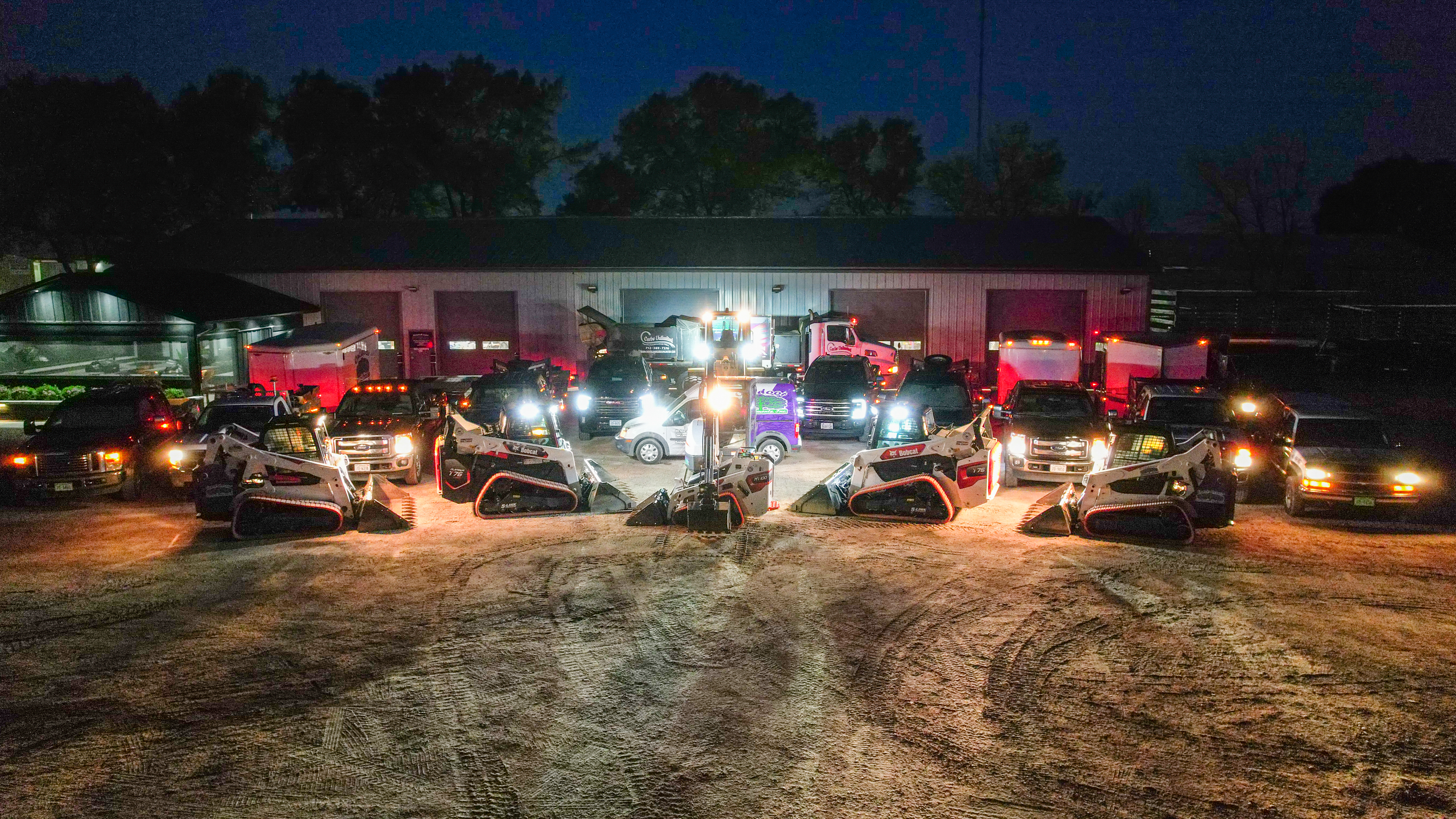 OEI fleet parked at the yard at night