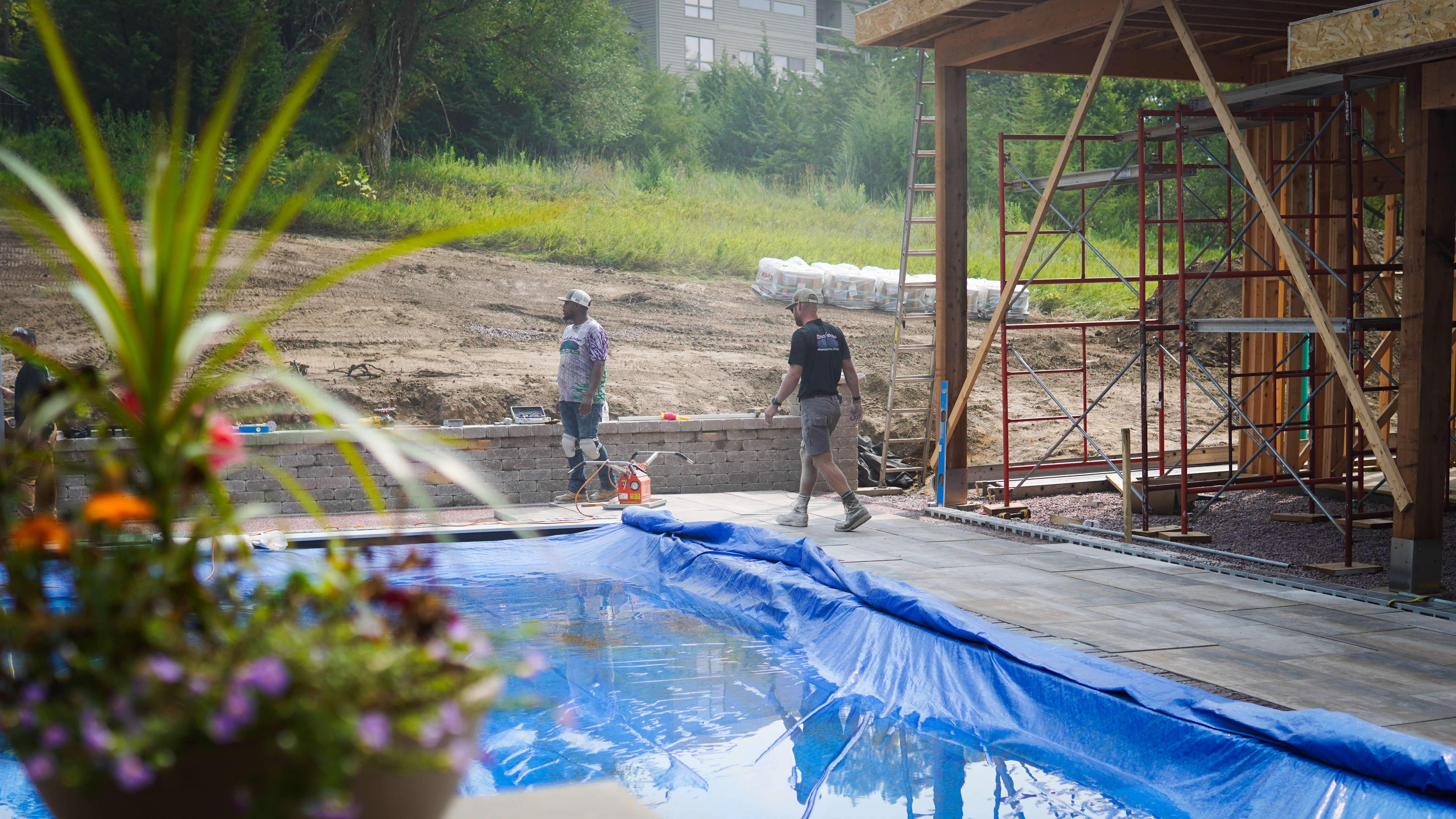 Pool construction in progress with protective cover