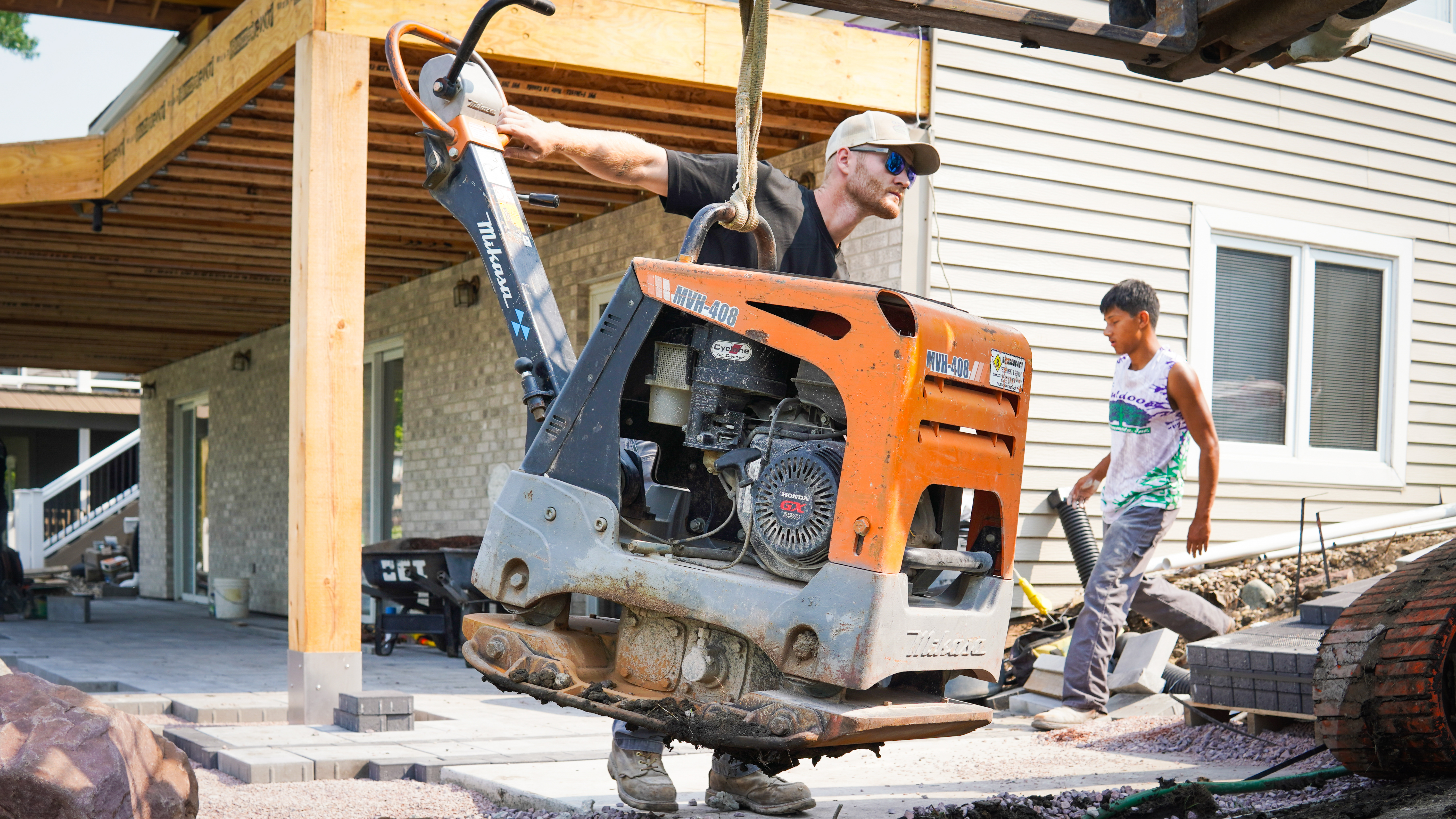 Operating a plate compactor (MVH-408) on the base
