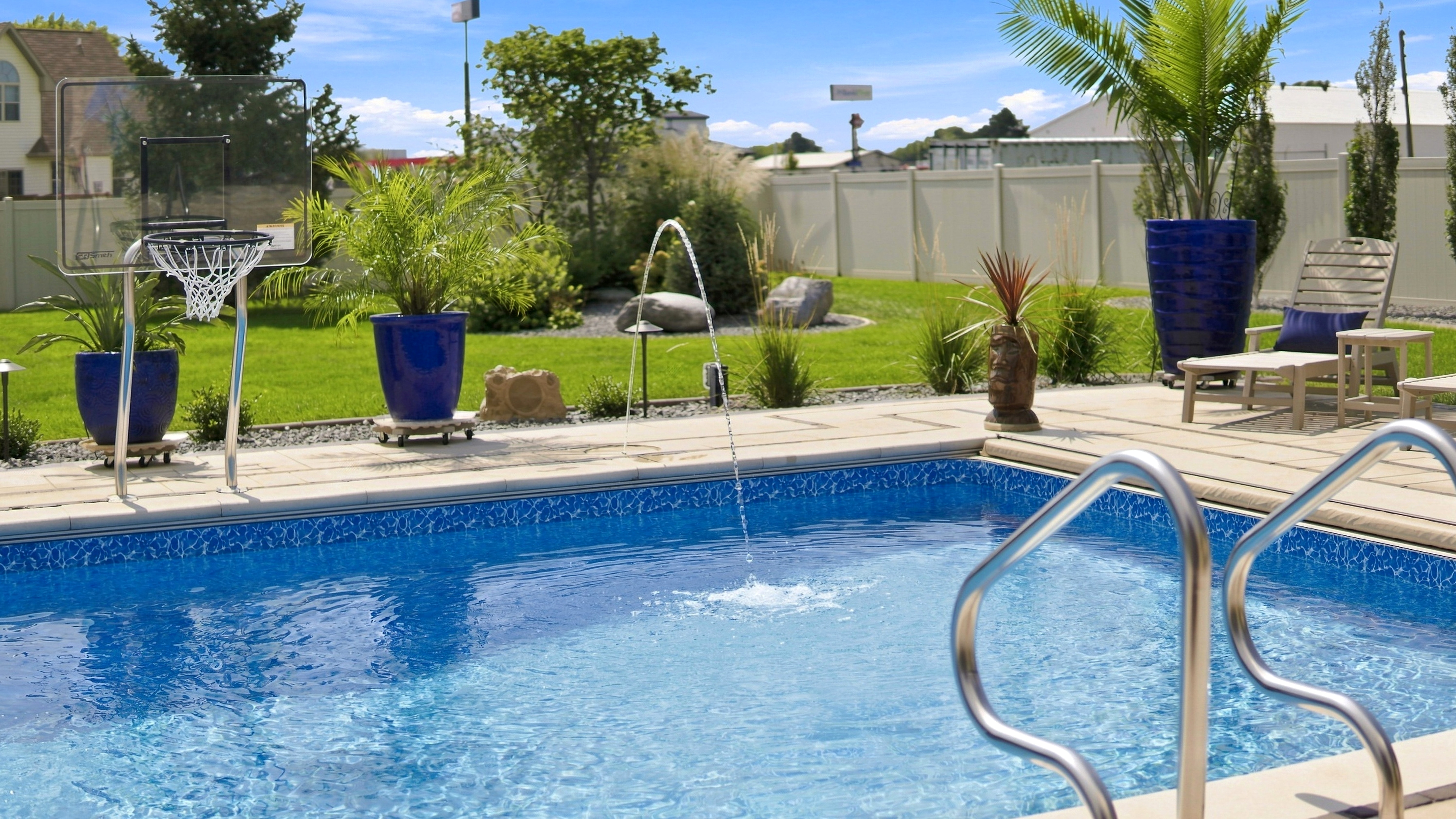 Custom Pool with Laminar Jet Lights, Basketball Hoop & Poolside Deck