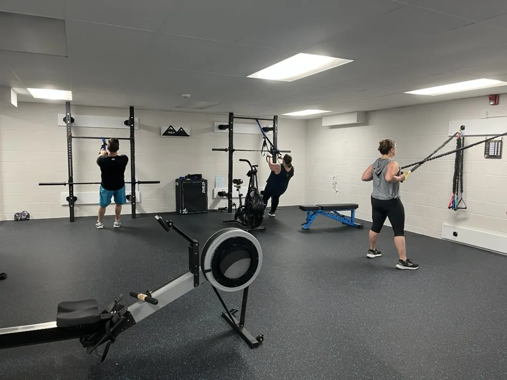 Functional Life coach guiding clients through a personalized training session