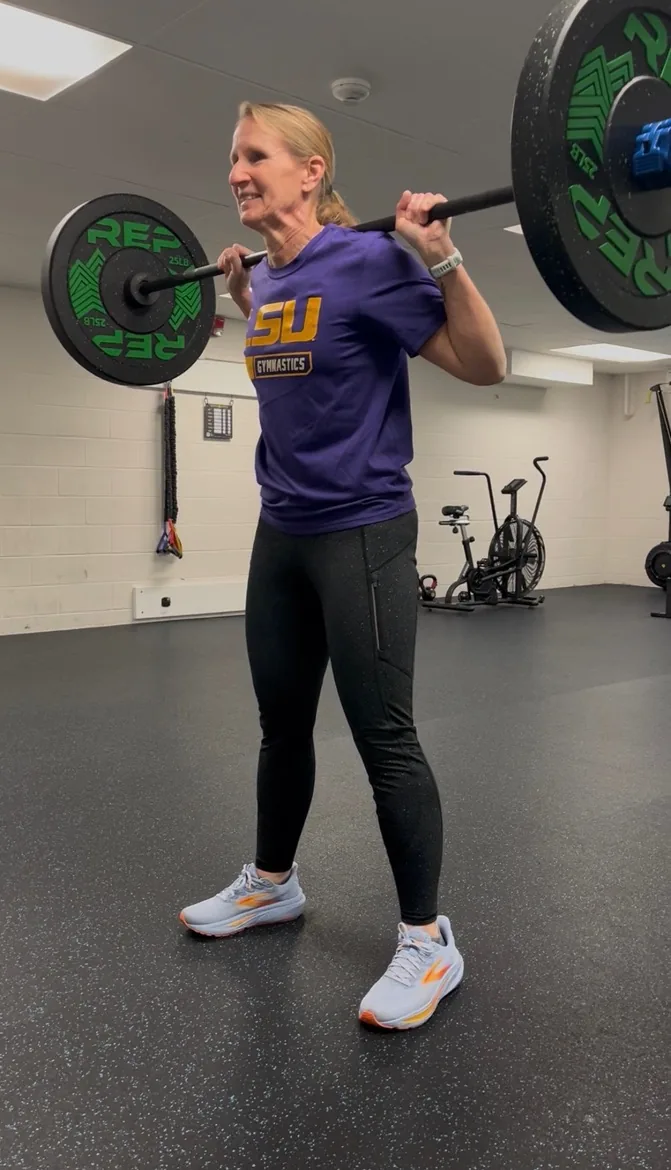 Functional Life client performing coached barbell strength training