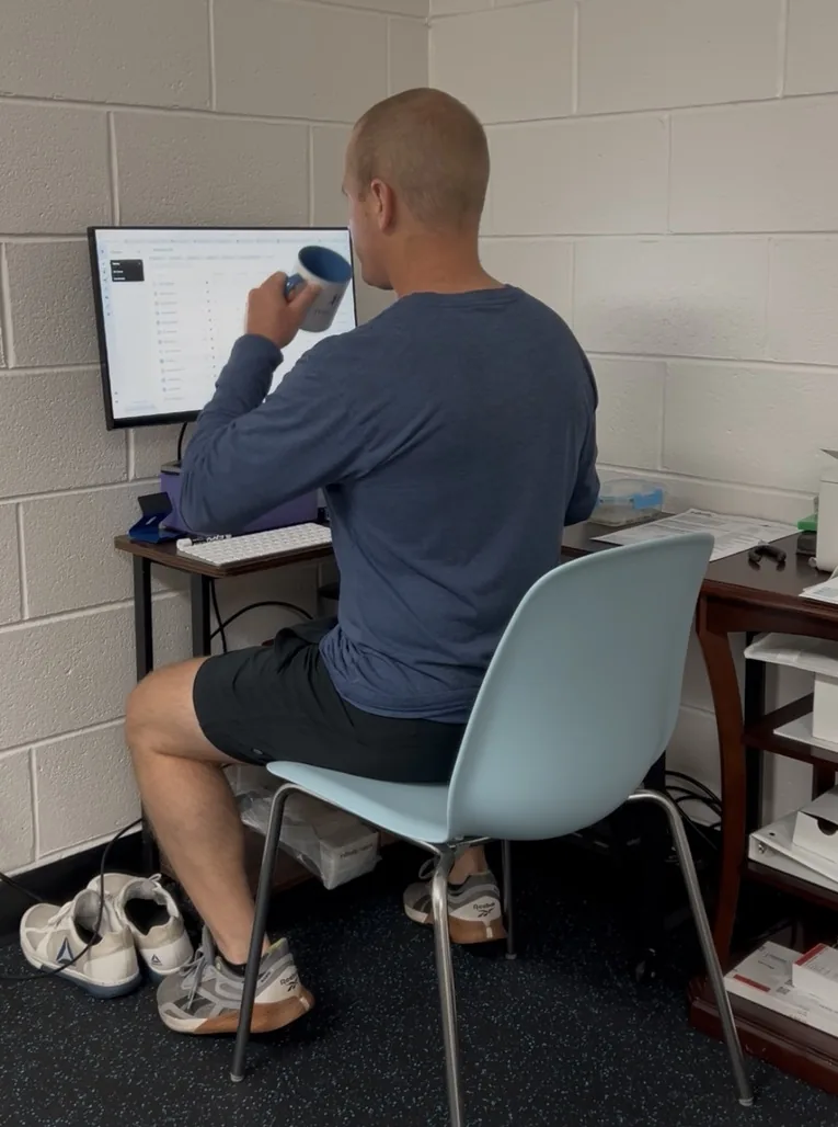 Functional Life coach guiding an adult client during personalized strength training