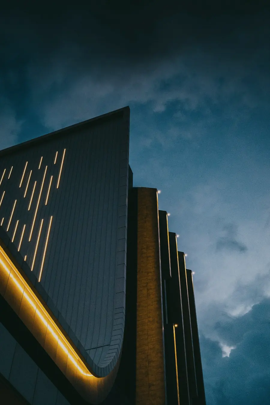 Modern facade with lines of light at night