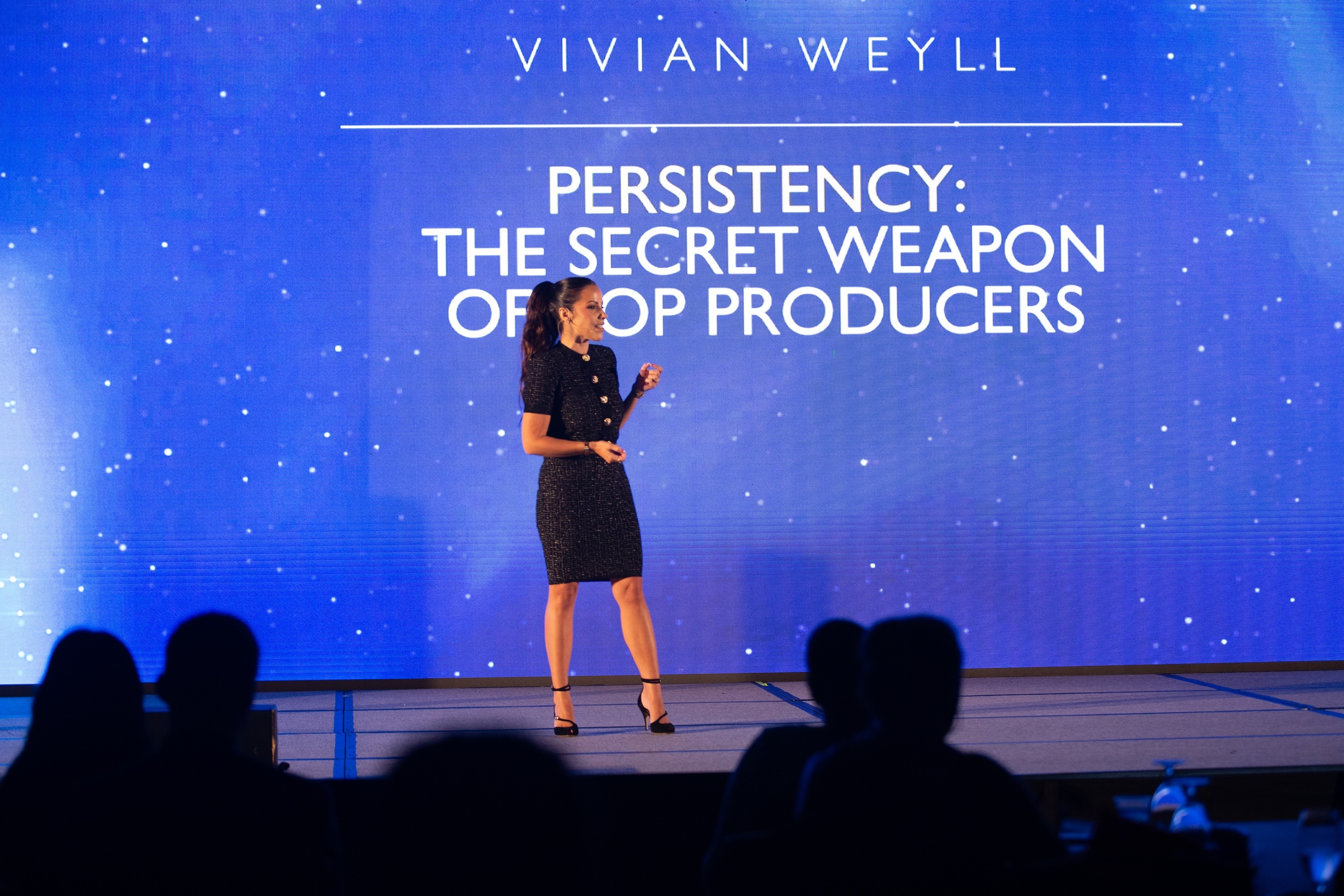 Vivian Weyll delivering a keynote on persistency to top producers