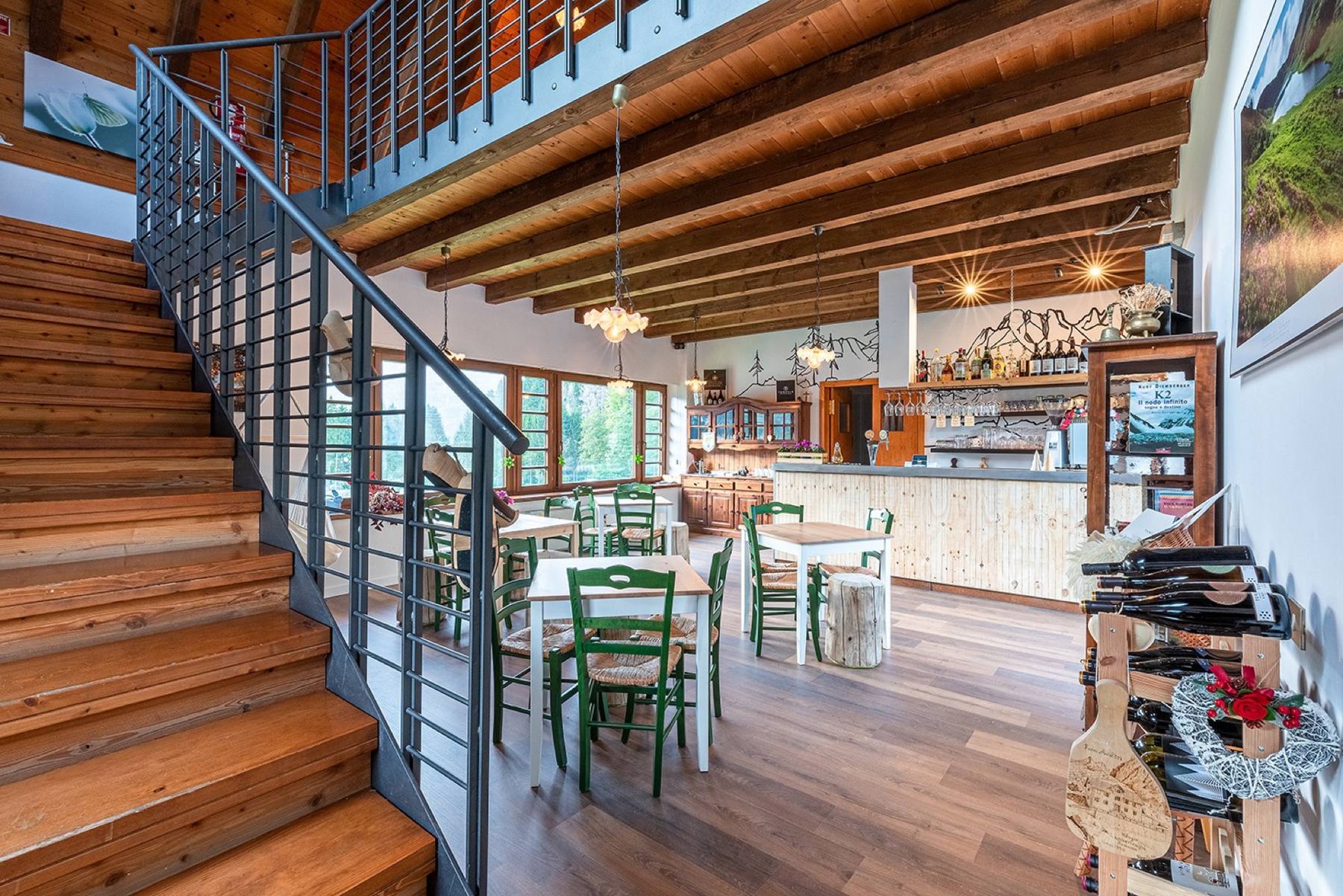 The ground floor dining room with the wooden staircase