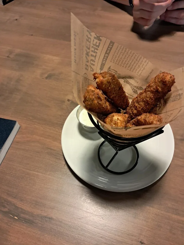 Crispy battered dill pickles fried until golden, served with a side of buttermilk ranch at The Harvest Table
