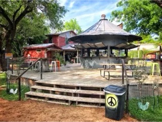 Exterior photo of Hippie Chic's River Shack retail store in Concan, Texas, selling Frio River apparel and gifts.