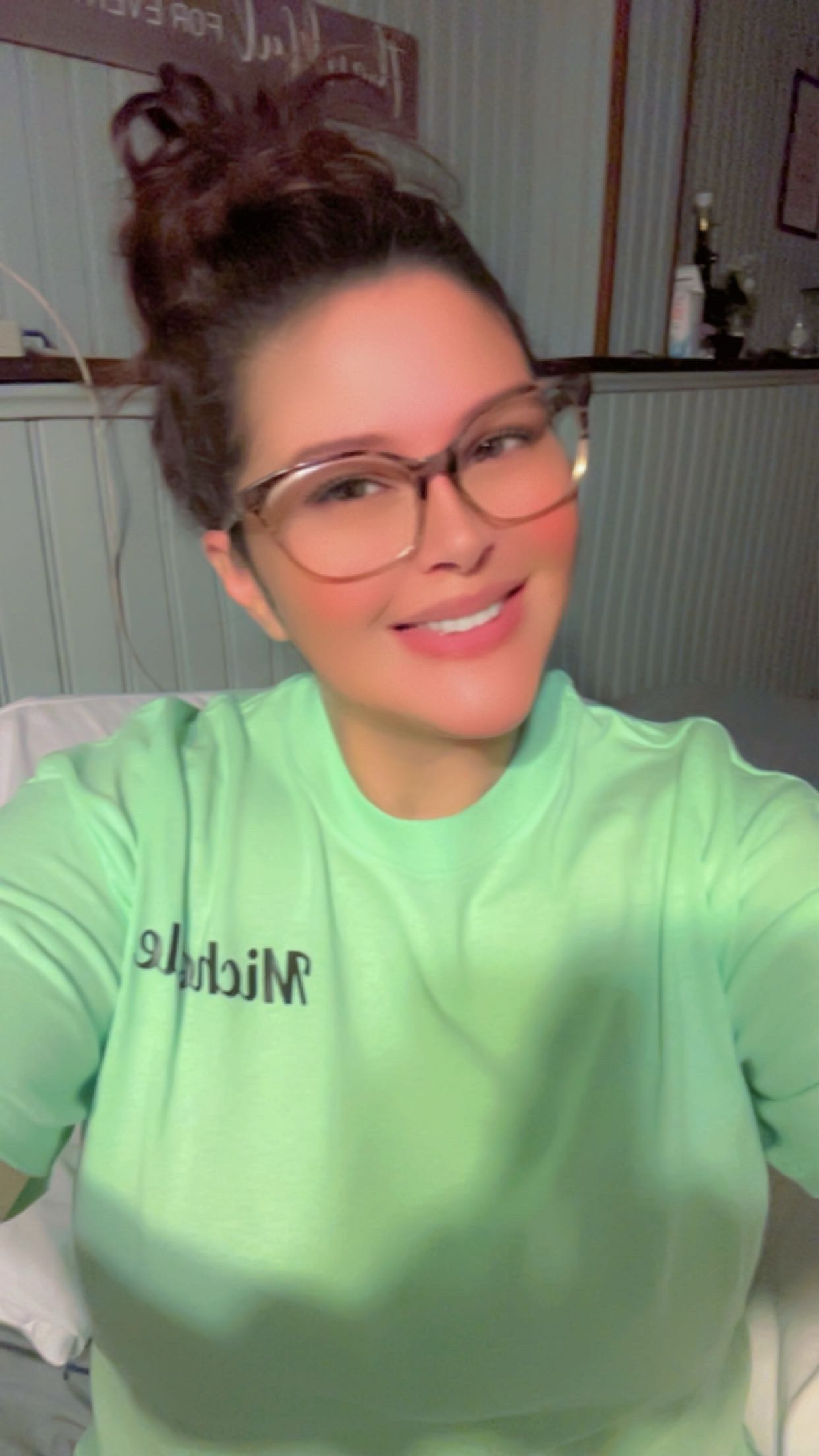 Michelle Fuchs, founder of More Free Time LLC, smiling in branded apparel