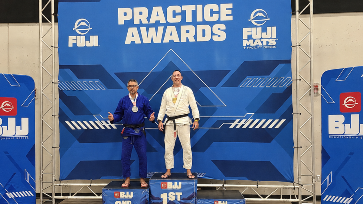 A young jiu jitsu student works through a sparring round on the mat at 608 Jiu Jitsu