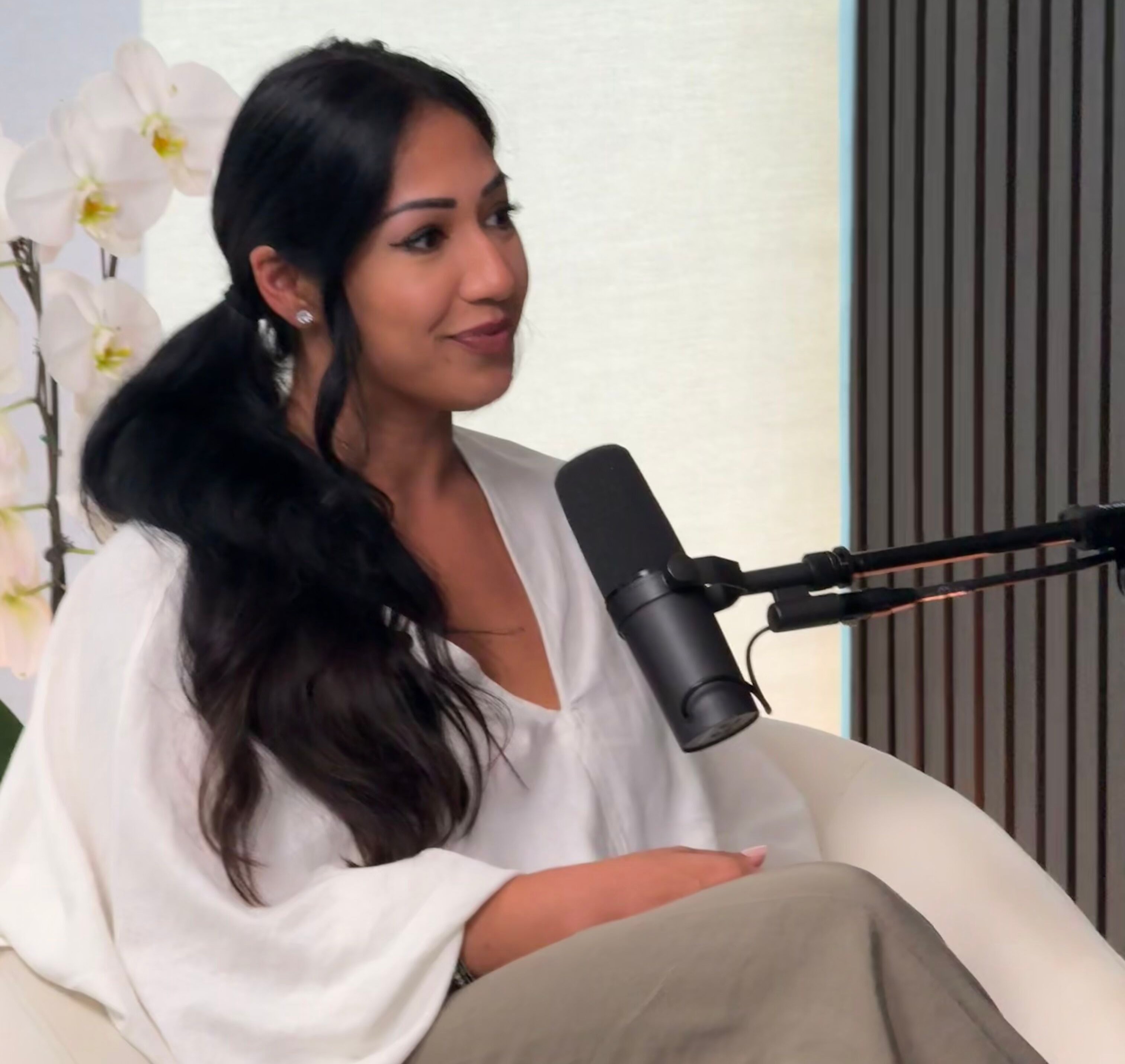 Coach Kavita speaking on a podcast