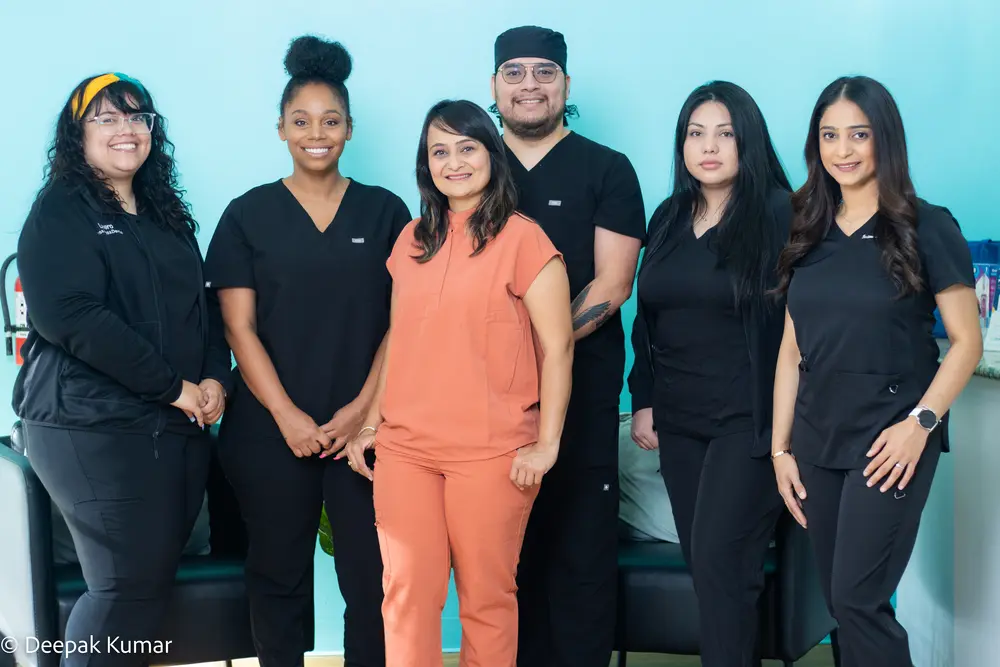 Dr. Nilam Patel and the Floss & Gloss Dental team - Bedford TX